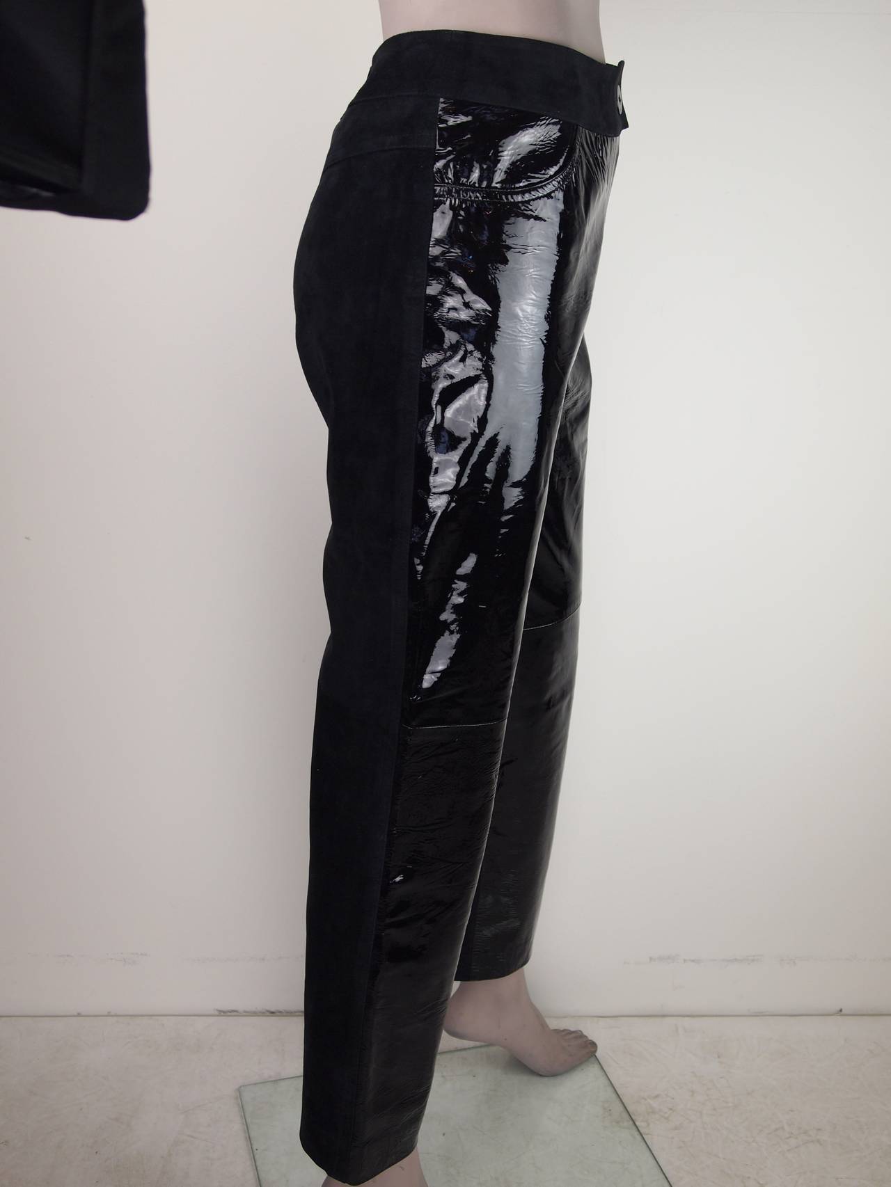 Chanel, Autumn/Winter 2001, black suede and patent leather pants with faux pocket detail at front, tonal seam accents throughout and zip closure featuring button closure at top, fully lined in silk.
Waist 28”, Hip 34”, Rise 11”, Inseam 27”, Leg
