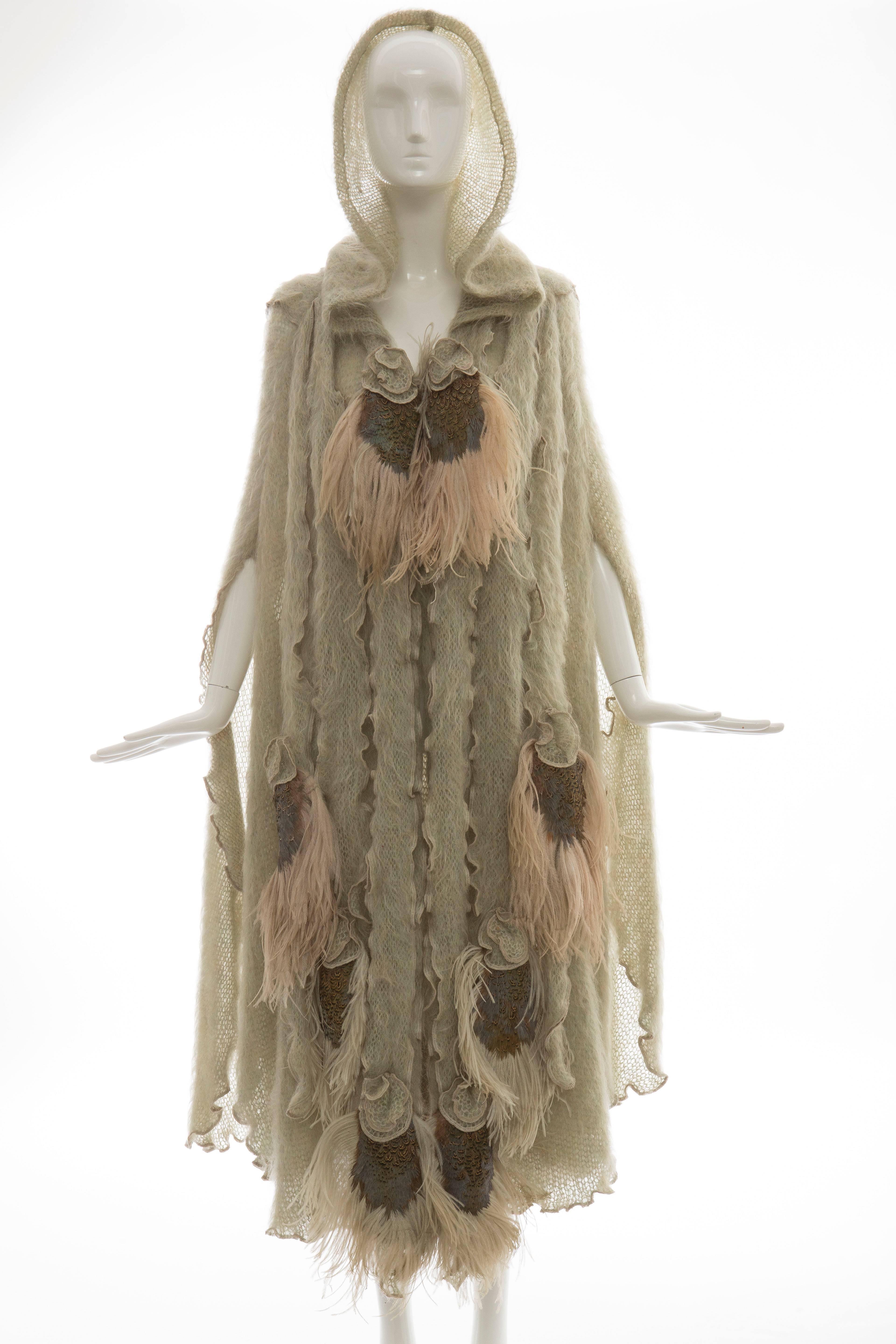 Diana Leslie, Circa 1980's sage green snap front hooded mohair cape with ostrich and pheasant feather front and back embellishment.

Bust 60, Waist 70, Hips 90, Length 53