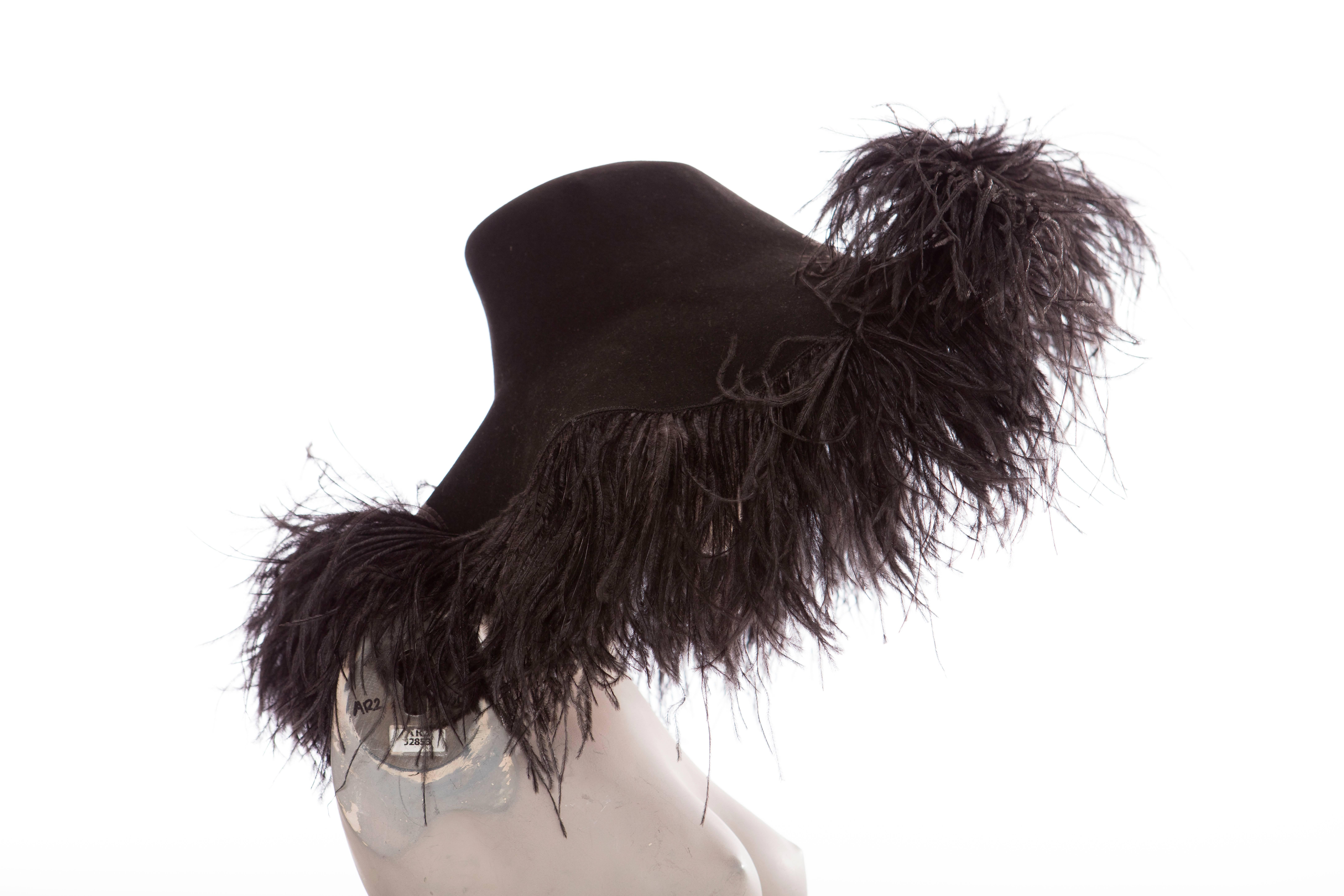 Alber Elbaz for Lanvin, Fall 2004 runway black wool felt hat with ostrich feather trim.

Circumference: 40, Brim 4