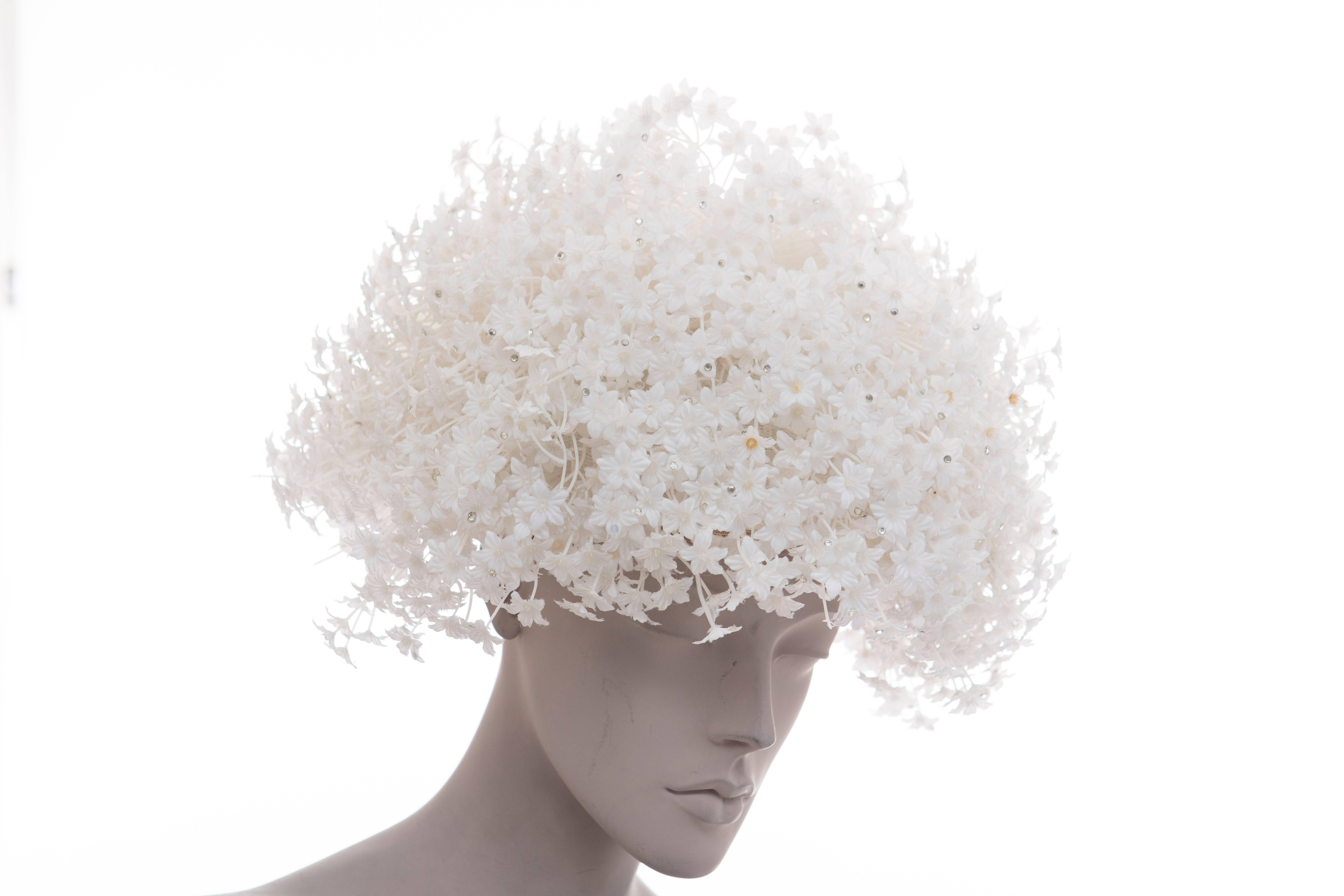 Jack McConnell White Mesh Hat With Flowers And Crystals.

Circumference: 23 Inch