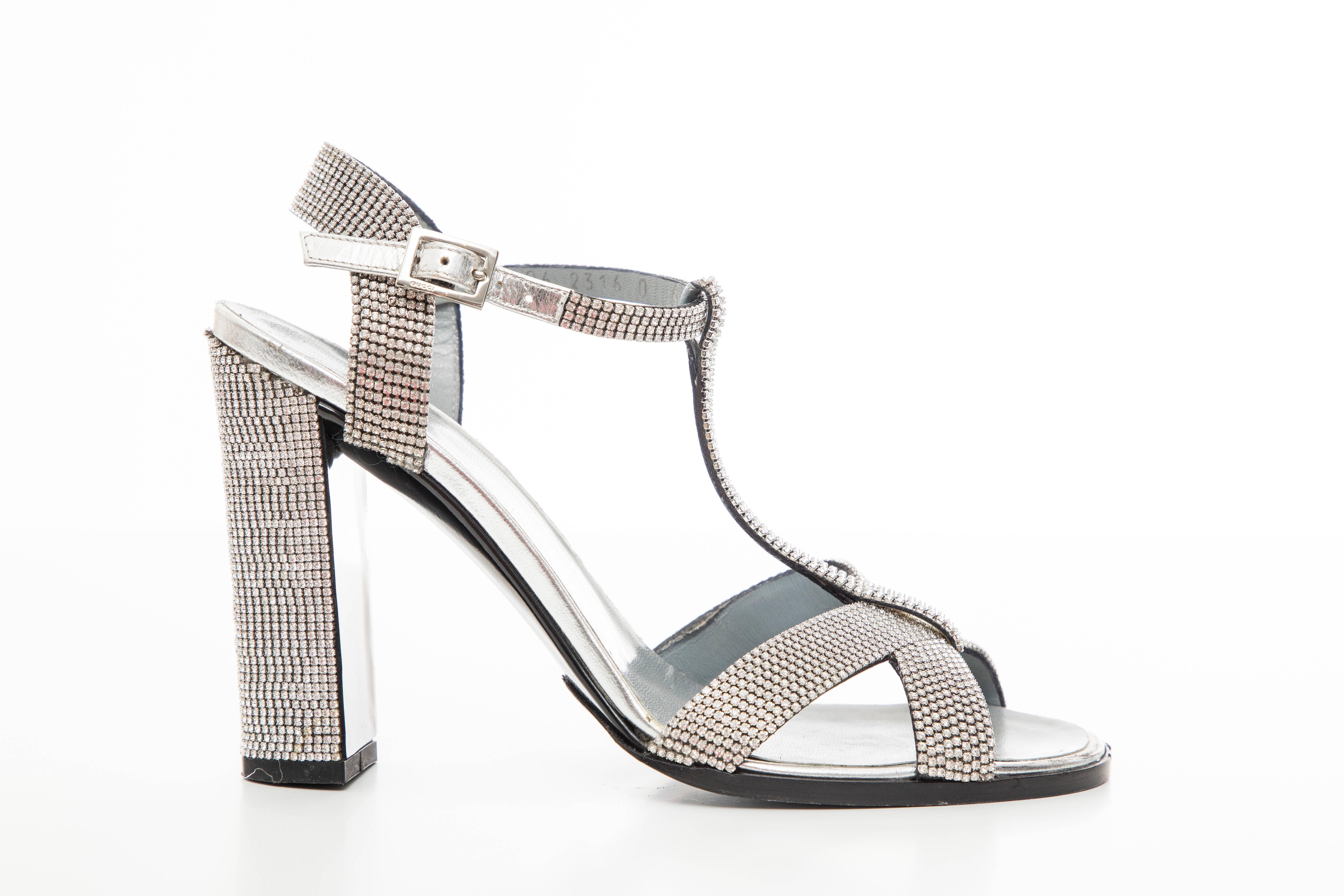 Tom Ford for Gucci, Spring-Summer 2000 metallic silver leather T-strap sandals with strass crystal embellishments throughout, covered heels and buckle closure at ankle straps. 

Heels: 4.25