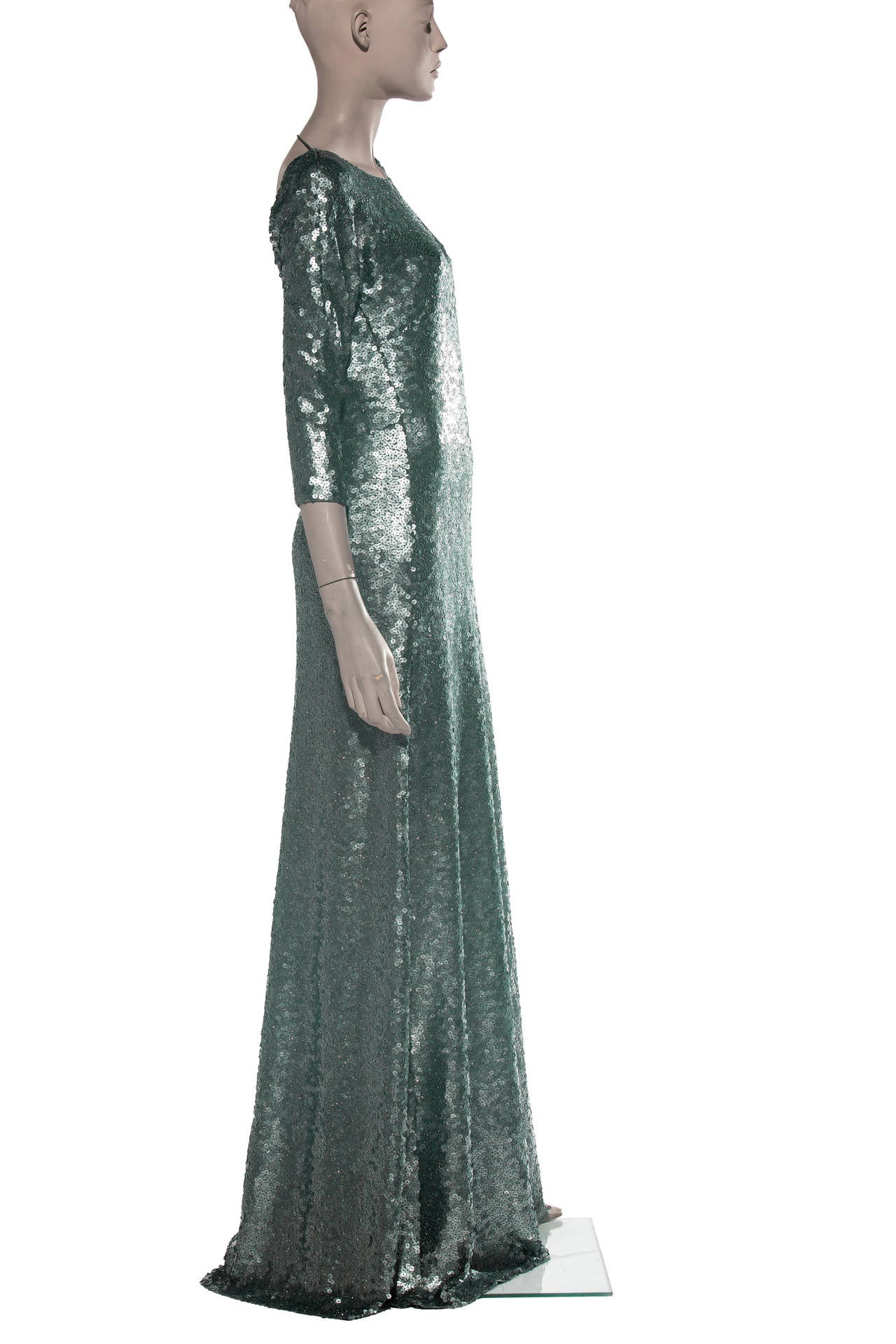 Marc Jacobs, Autumn/Winter circa 2013, backless sequin evening dress, three-quarter length sleeves, invisible back zip and fully lined in silk. This dress was showcased on the cover of Vogue magazine with Sandra Bullock.

Bust 34”, Waist 32”, Hip