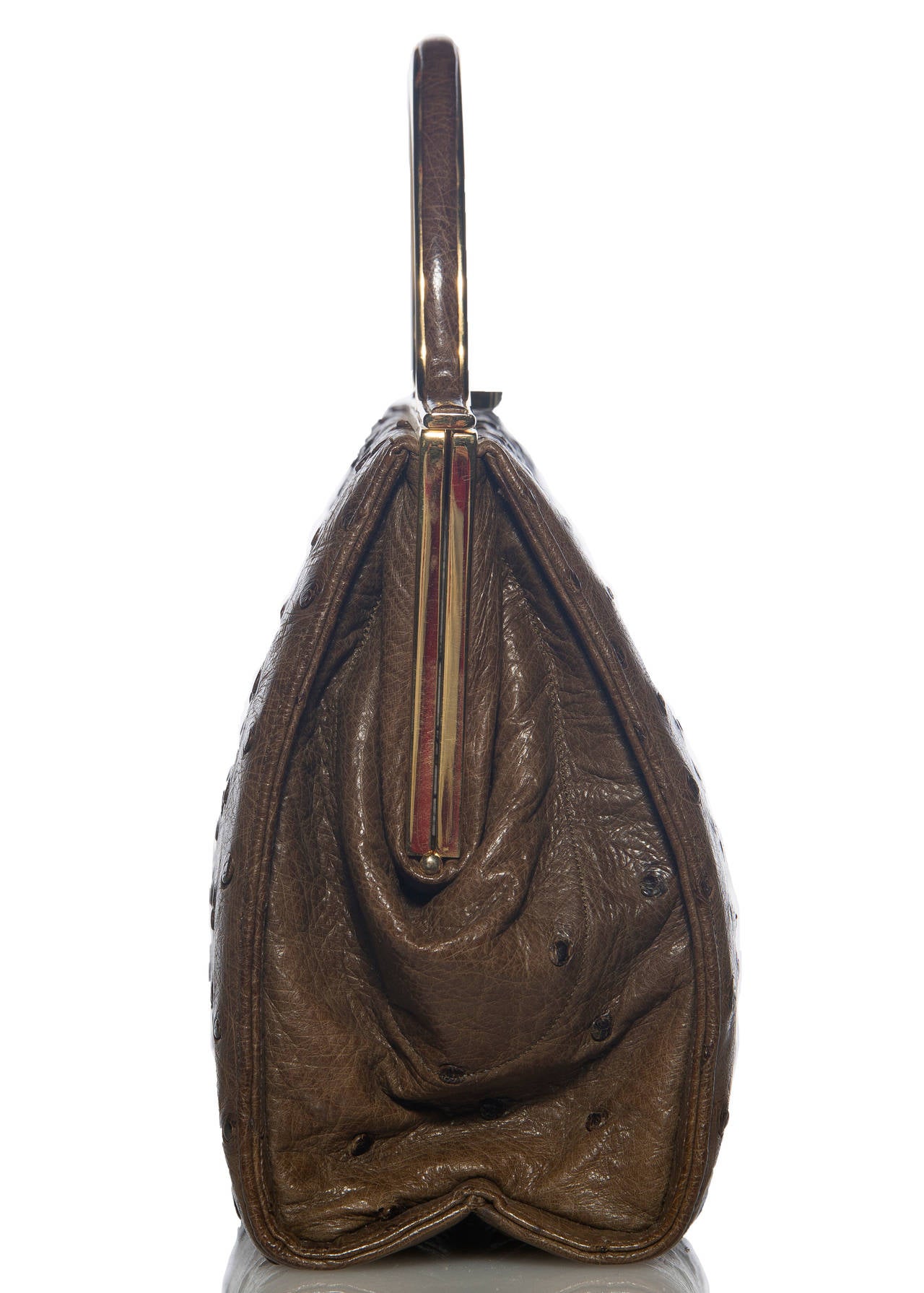 Judith Leiber ostrich handbag, two interior pockets with one zip, mirror, comb and change purse, fully lined in satin.