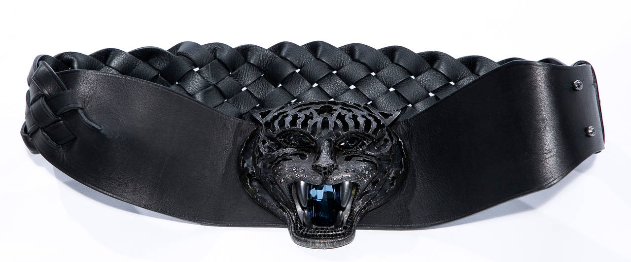 Alber Elbaz for Lanvin, Fall 2012 Pandora belt, black braided leather with aged silver-tone tiger center piece, faceted Swarovski crystals at hardware, and peg buckle closure. 
Retail: $2400 

Length 31.5“-33.5”, Width 4”