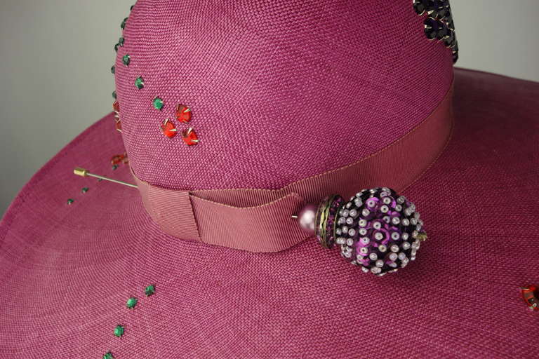 Adolfo woven straw hat with prong set crystals.