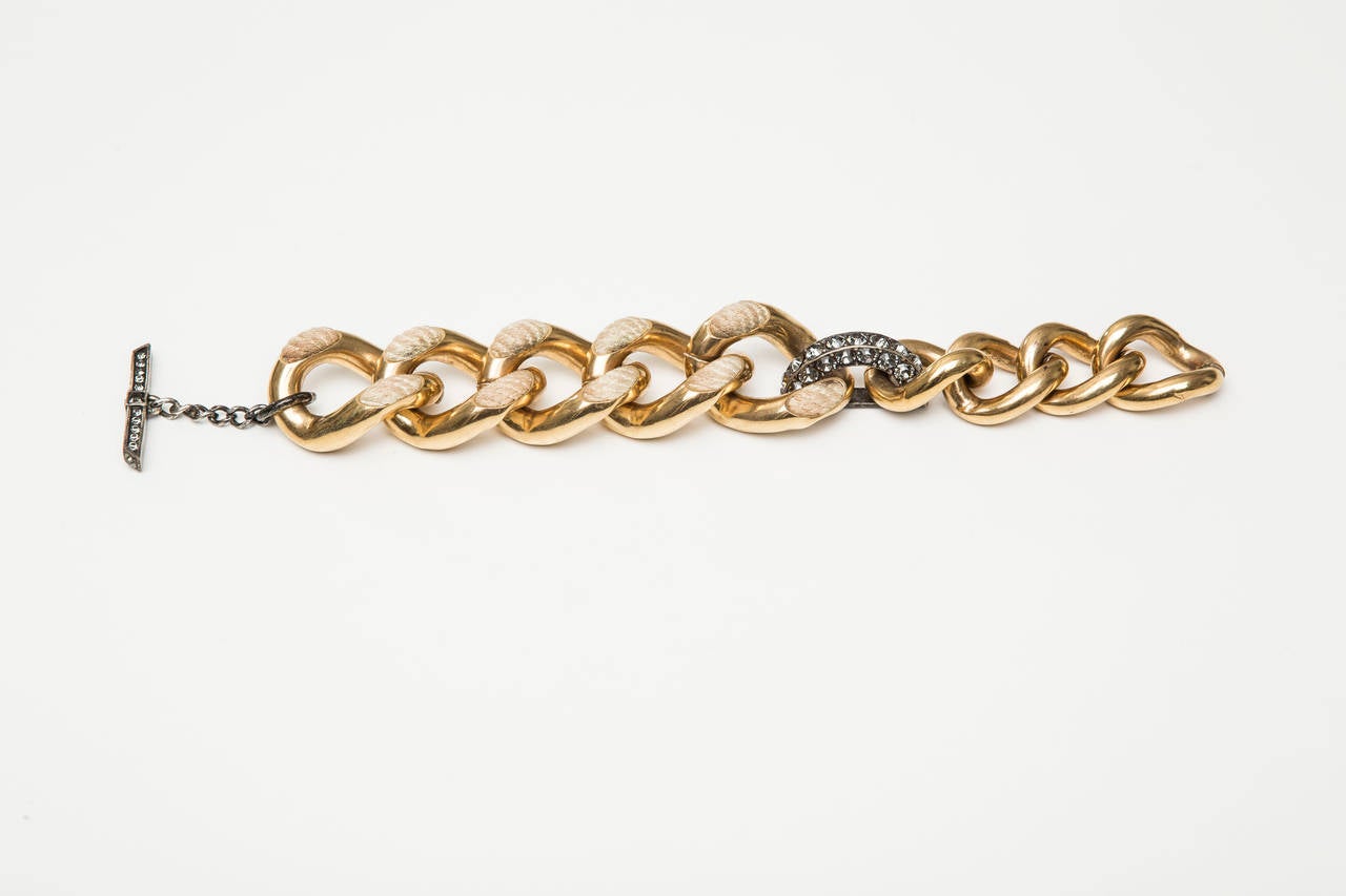 Lanvin brass and silver-tone chain bracelet with rope detail, swarovski crystals and T-bar closure.

Circumference 9.5”, Width 1.13”