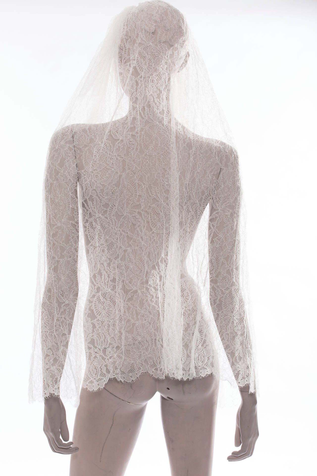 Lanvin ivory lace wedding veil with a comb and pearl detail.