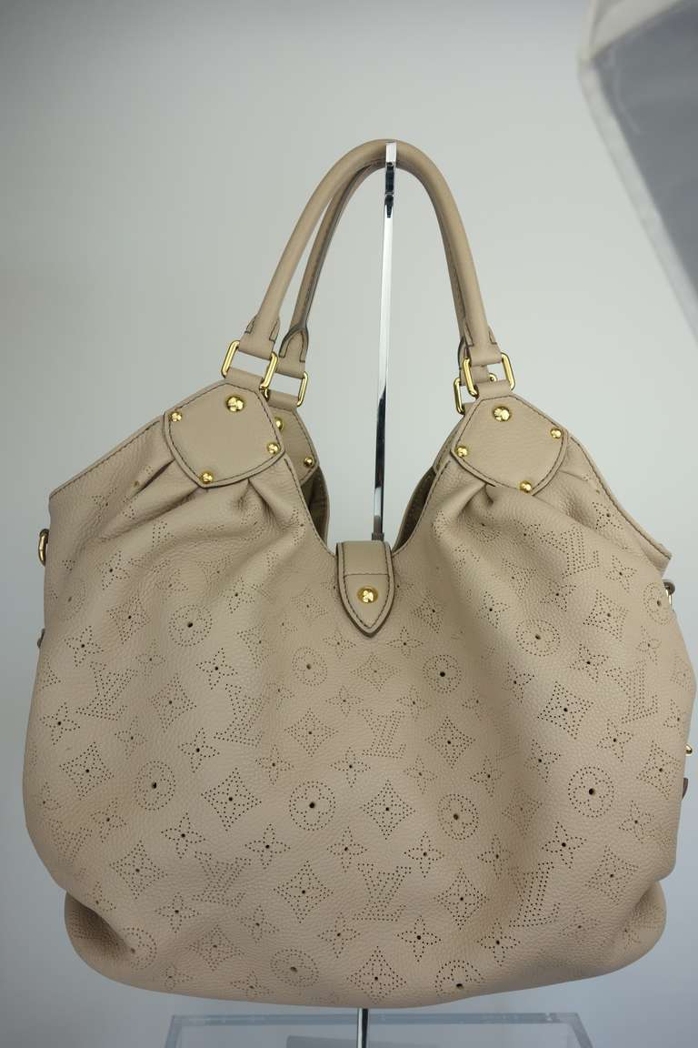 Louis Vuitton Mahina handbag, gold tone hardware and one zip interior pocket.