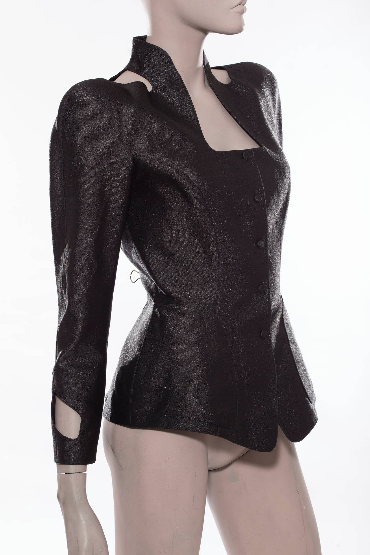 Thierry Mugler, circa 1980's, black snap front jacket with cut-out sleeve and shoulder.