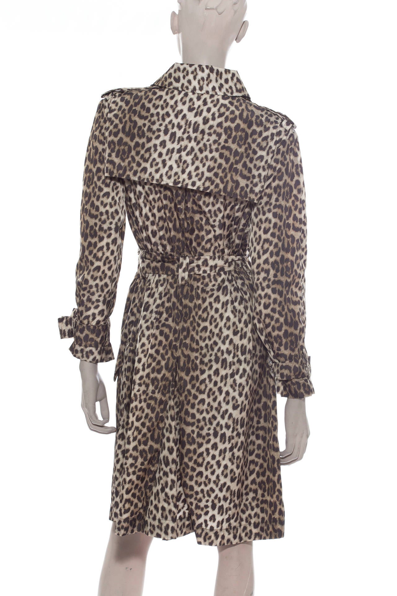 Lanvin pre- fall 2010, button front,  jaguar print  trench coat, two front pockets, epaulets with self belt.
