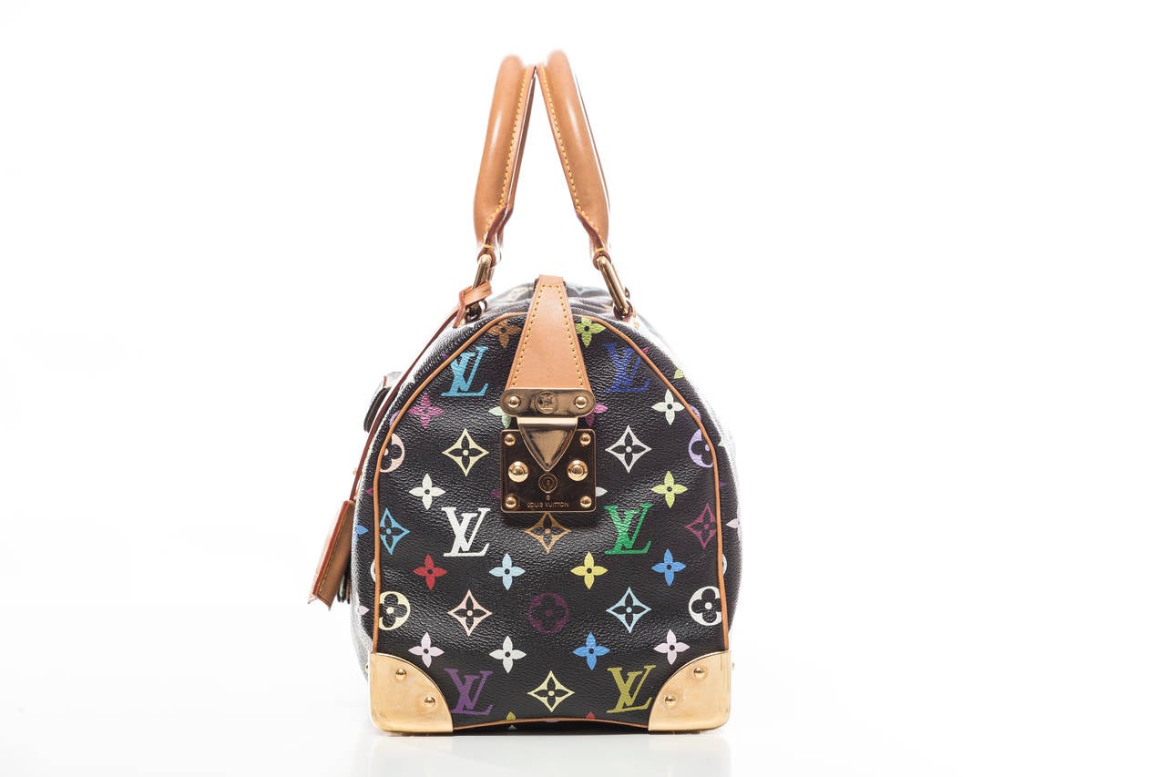 Louis Vuitton Speedy 30 with brass hardware, tan vachetta piping and handles, front flap pocket with D-lock, beige Alcantara lining, one interior pocket and top zip closure.  Includes dust bag.

Handle Drop 4”, Height 10”, Width 12”, Depth 7”