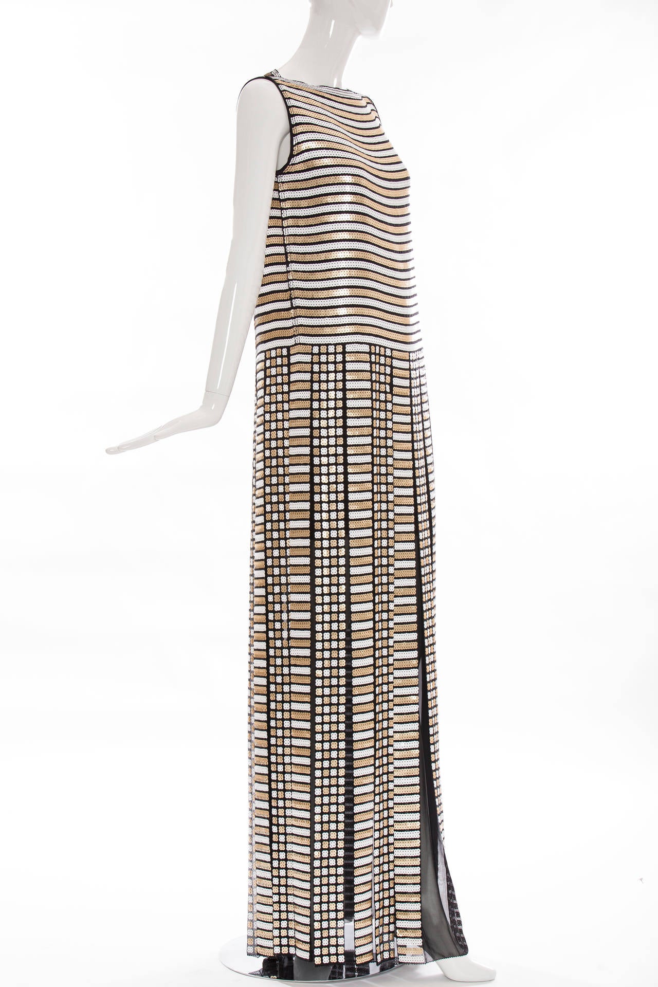Marc Jacobs Spring 2013, black, white and metallic sequin sleeveless evening dress with pleated skirt featuring peek-a-boo silk detail and concealed zip closure at center back.

US 6
Bust 36”, Waist 38”, Hip 40.5”, Length 62”