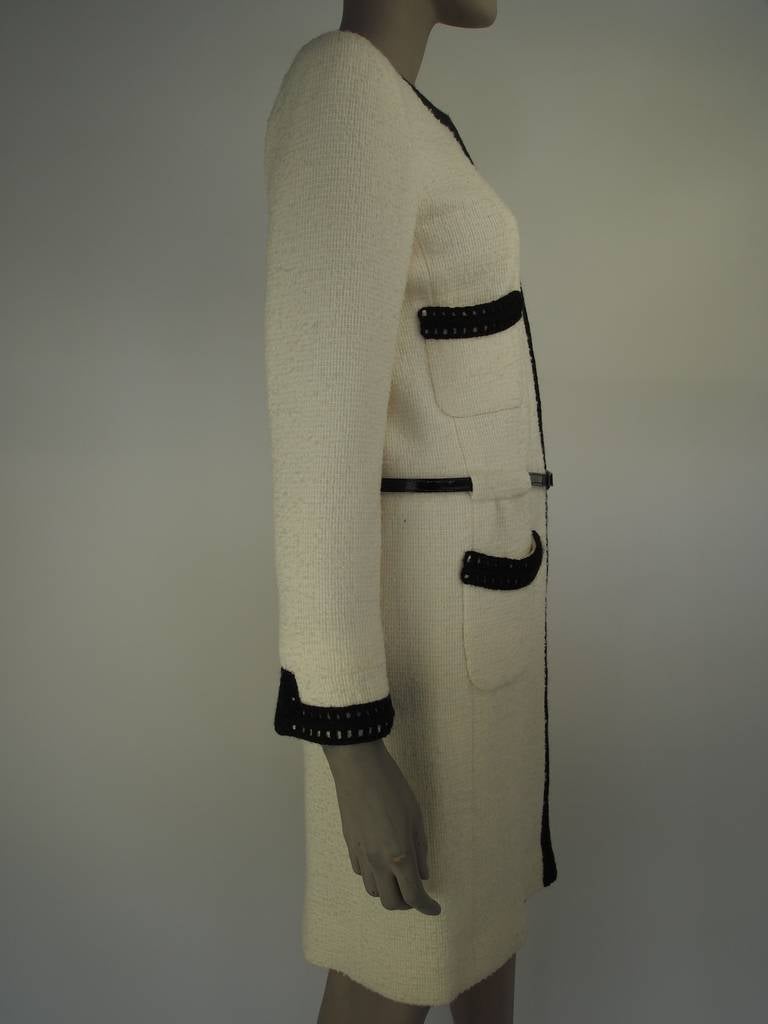 Chanel, Autumn - Winter 2000, white wool coat of alpaca and wool tweed, snap front, four front pockets, black knit trim, black patent belt and fully lined in silk.

This Karl Lagerfeld / Chanel coat is part of the Kyoto Costume Institutes fashion