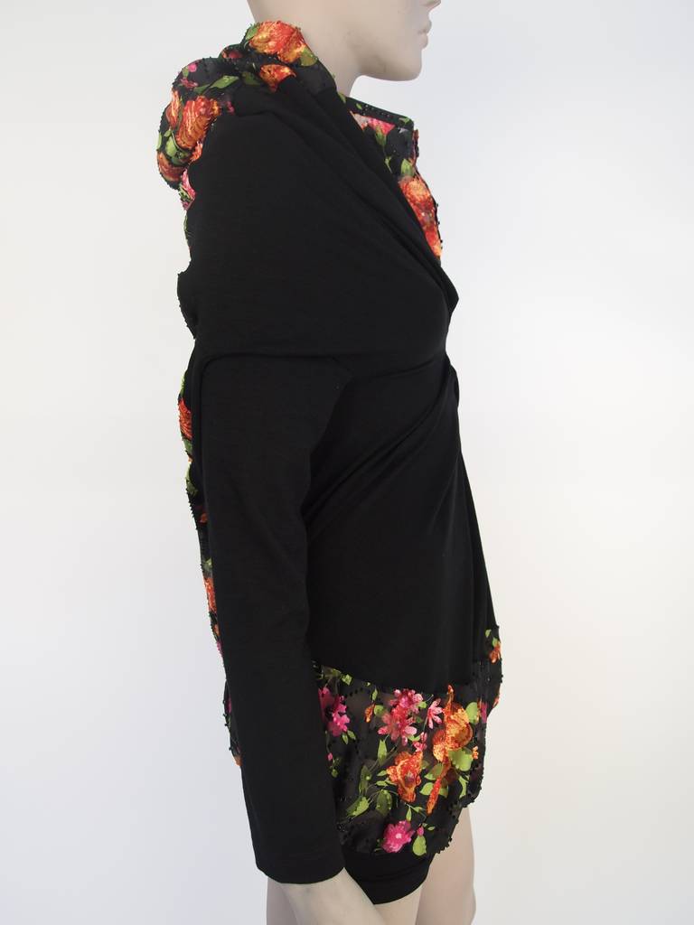 Comme des Garcon black, long sleeve,wool sweater, floral button front collar, and floral back and hem.