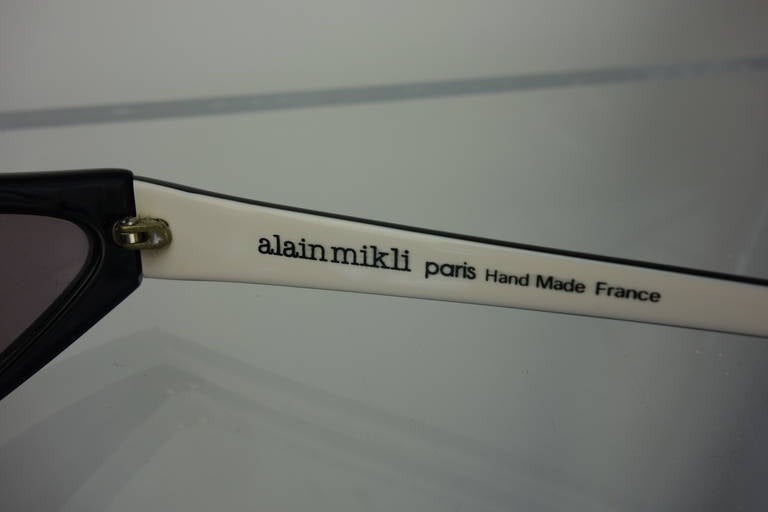 Alain Mikli, 1980s, asymmetrical black/white sunglasses.