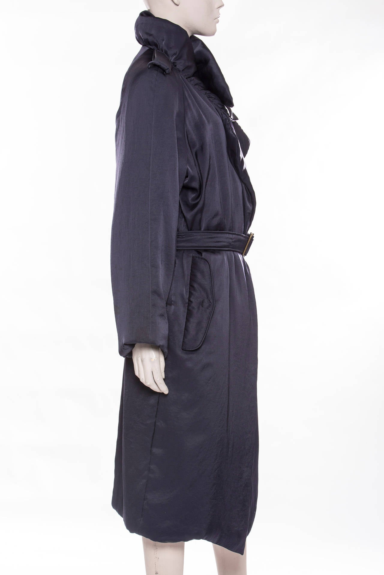 Lanvin, Fall 2006 midnight blue coat with flap pockets, notch collar and belt at waist featuring buckle closure.

EU. 42, US. 10

Bust 46", Waist 40", Shoulder 17", Length 36"
Fabric Content: 88% Triacetate, 12% Polyester