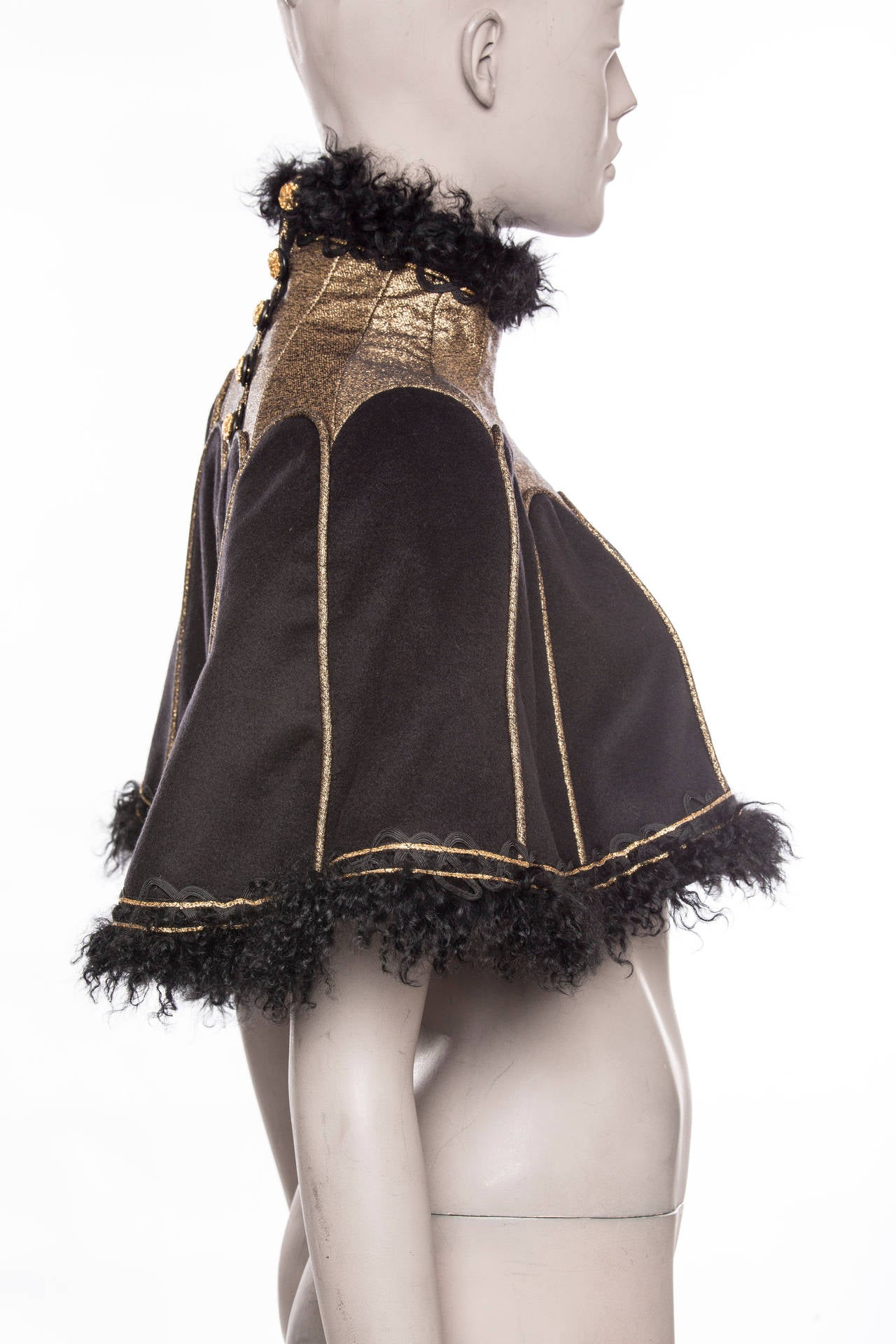 Chanel, Pre-Fall 2009, Paris Moscow Collection,  cashmere capelet with lamb fur trim, standing collar, contour piping, grosgrain trim at hem, back medallion French button closures and fully lined in silk.

FR. 38
US. 6