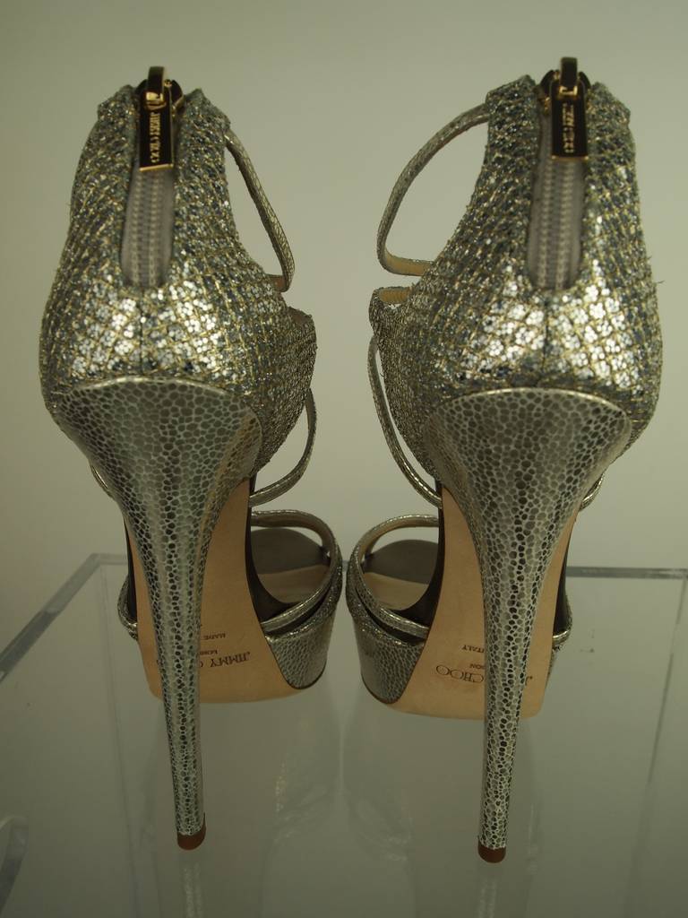 Jimmy Choo silver, 5 inch open toe heels with original box and dust-cloth.