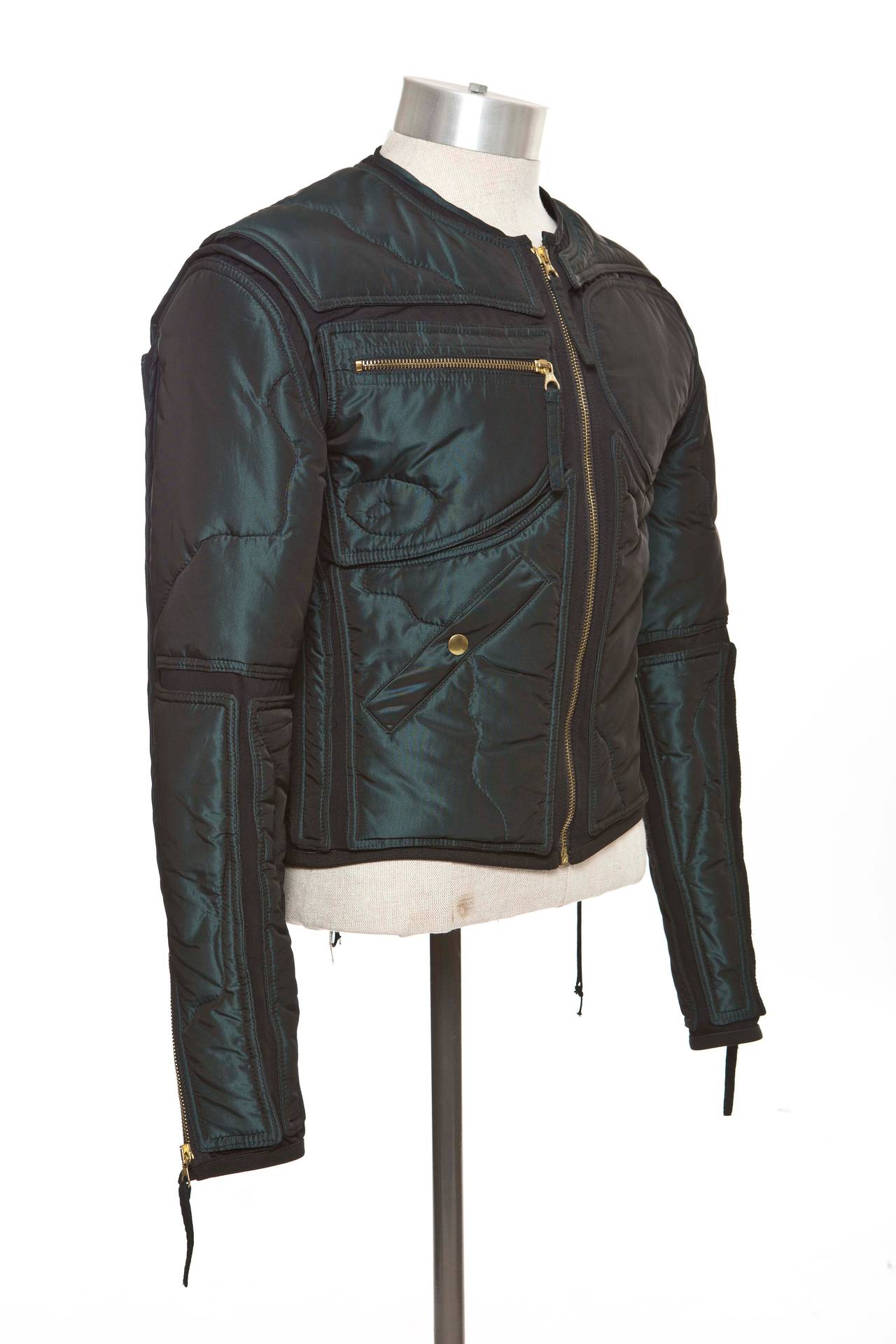 Jean Paul Gaultier, Fall1995, jacket with zippered sleeve cuffs, zippered chest pockets, two pockets at front; one with zip closure and one with snap closure and exposed zip closure at center front. Size not listed, estimated from