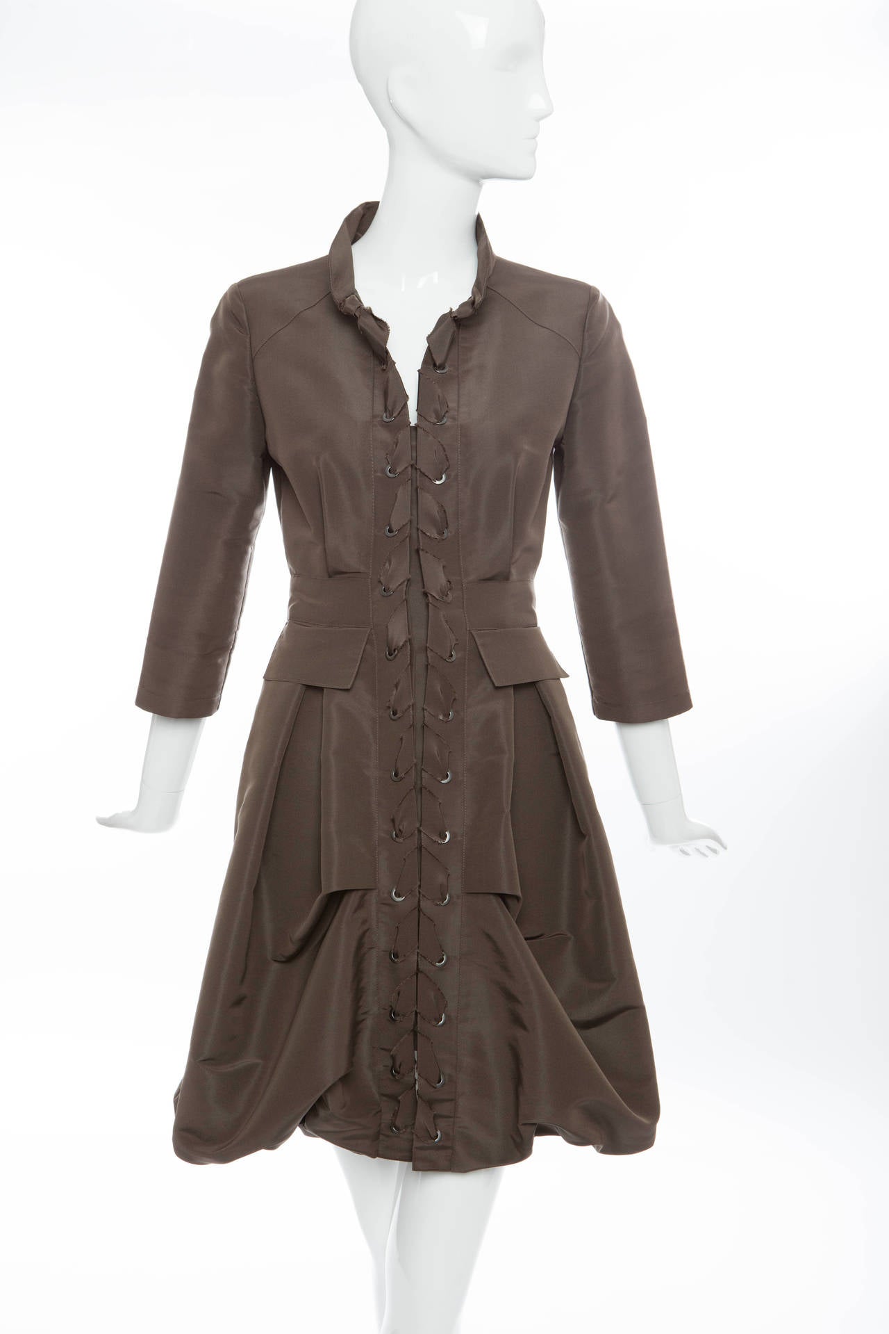 Oscar De la Renta, Resort 2011,chocolate brown, button front dress,3/4 length sleeves and fully lined in silk.