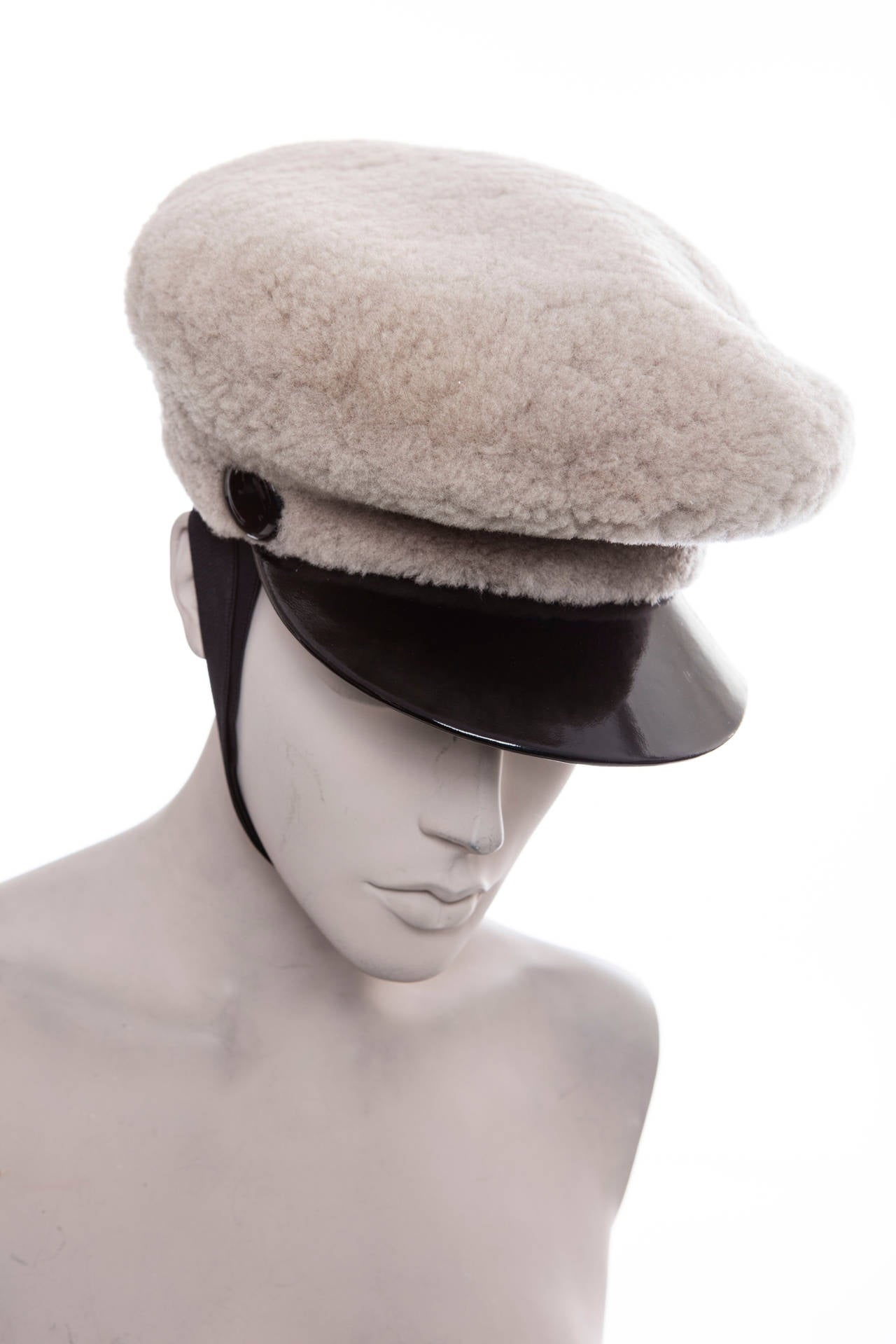 Marc Jacobs for Louis Vuitton, Fall 2010, grey wool night porter hat with black patent leather trim.

Circumference 24.5