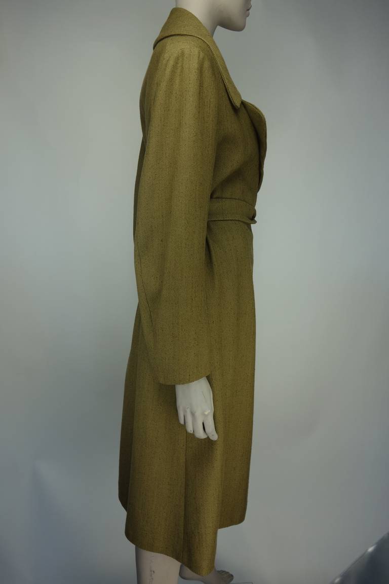 Dries Van Noten coat with self belt, two front pockets and fully lined in silk.