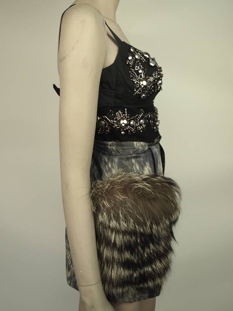 Prada, Autumn/Winter 2006 - 2007 sleeveless dress with nuts, bolts, and miniature utensil embellishment, felted inset, printed skirt, fox fur trim at side pocket and concealed back zip.