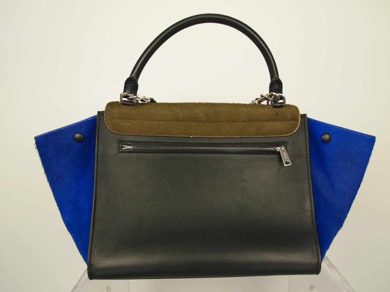 Celine Trapeze pony hair trapeze handbag, top handle,removable leather shoulder strap, two interior pockets, outer back zipper pocket and a clip-lock closure.