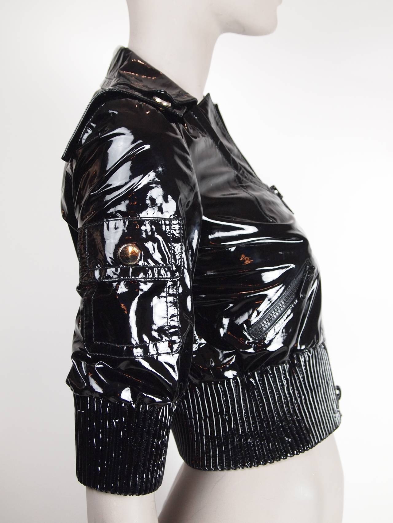 Gucci  black patent leather cropped jacket with zip front.
