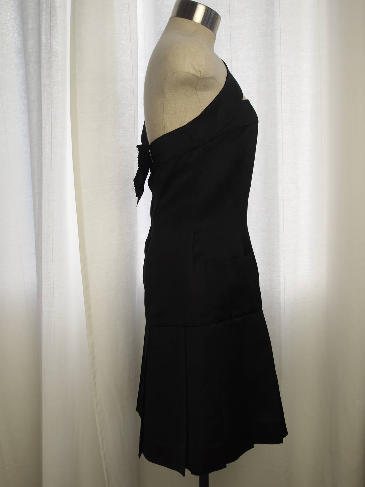 Chanel, black silk satin dress,hidden back button with bow and fully lined in silk.