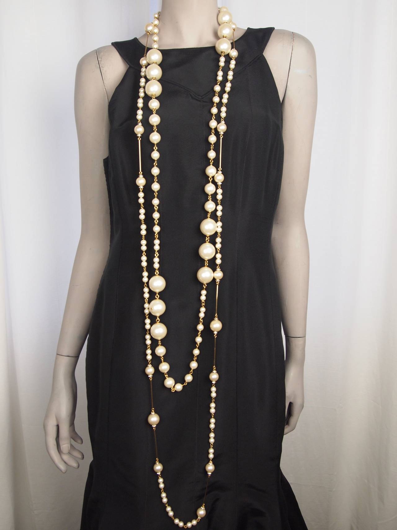 Pair of Chanel long pearl necklace with Chanel box.
Pearl necklace 74 inch and 56 inch