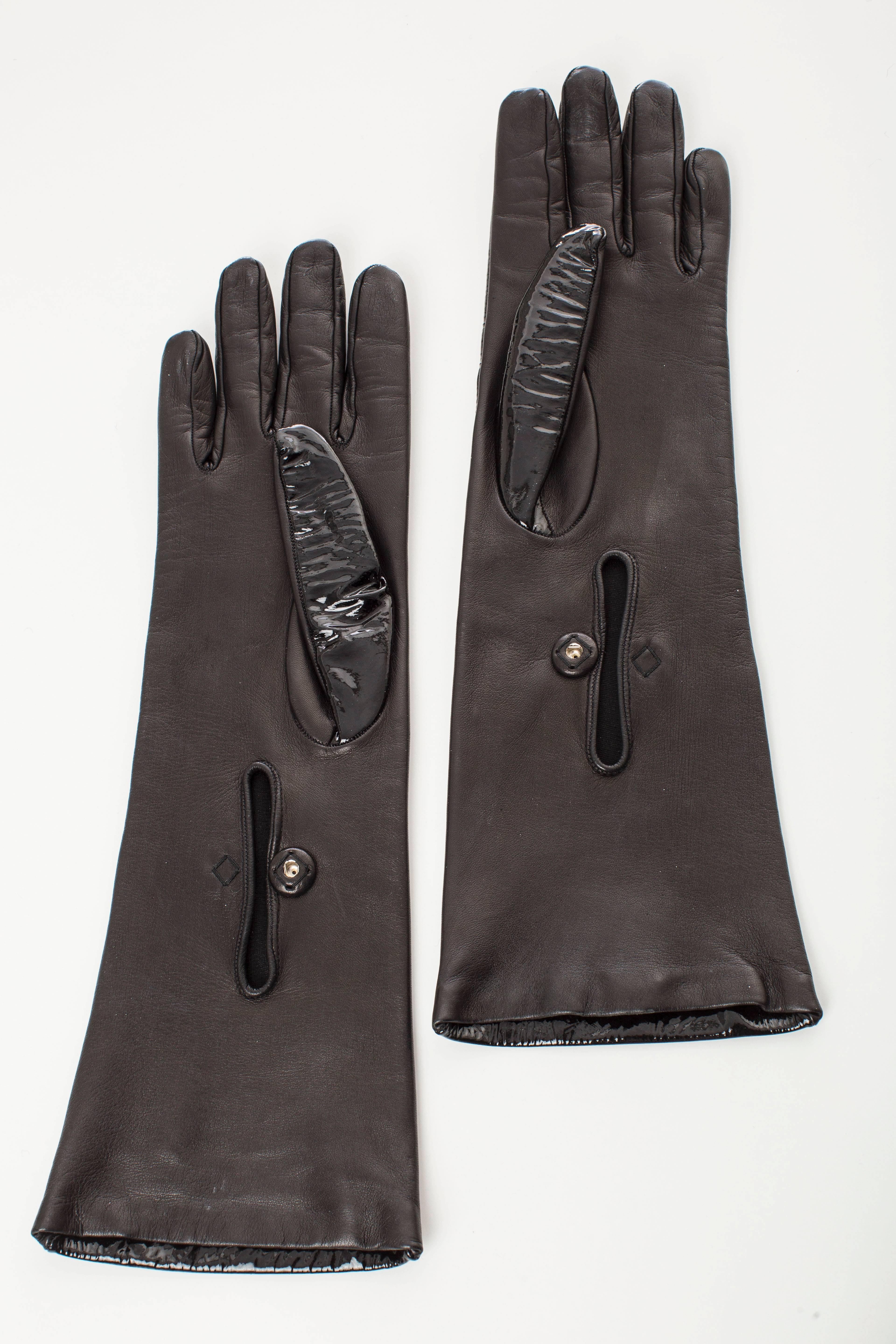 Prada, black patent leather gloves with snap closure at forearm. Includes box

Length 14