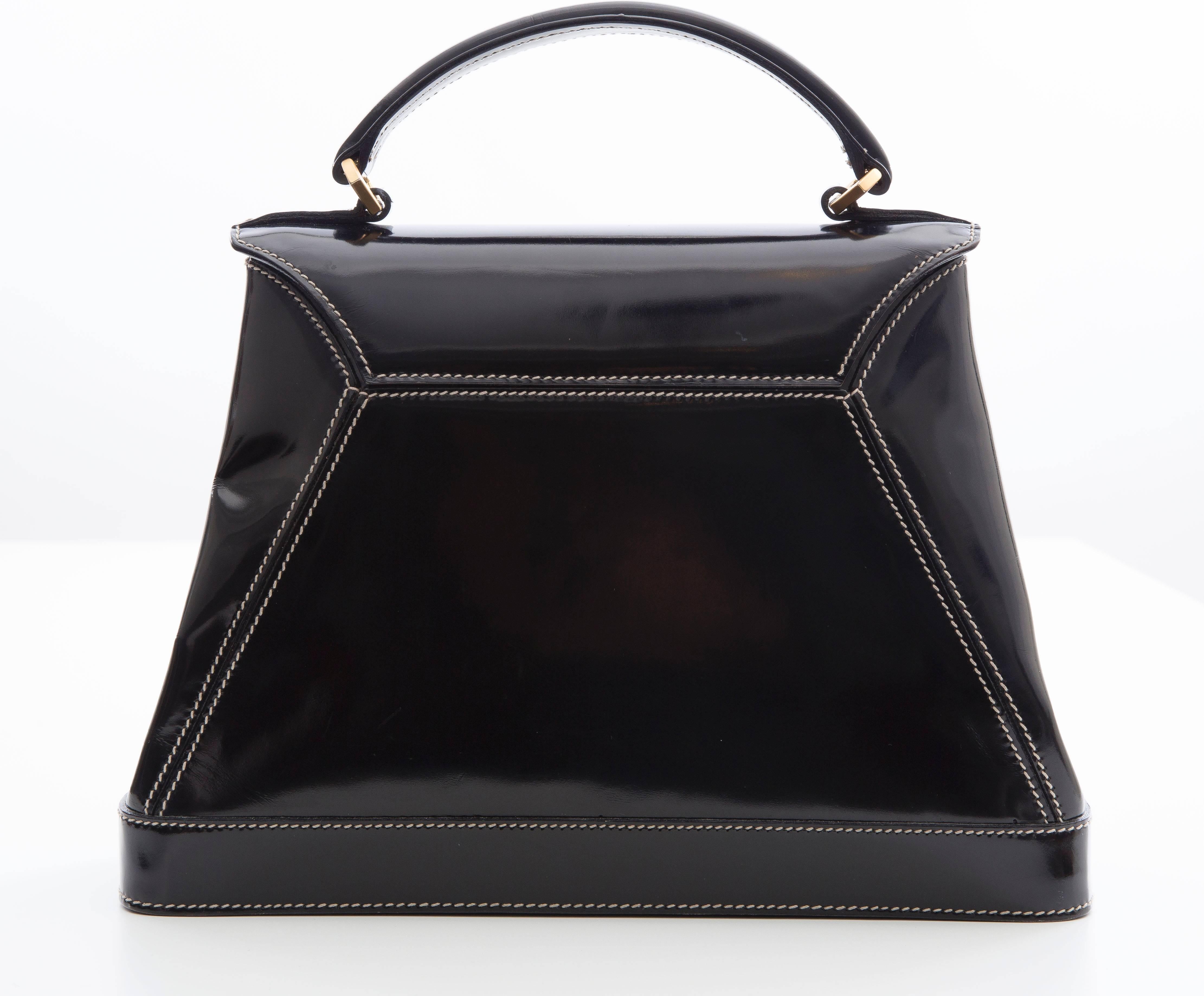 Karl Lagerfeld, circa 1990's, black patent leather handbag, interior zip pocket, detachable shoulder strap and original dust bag.