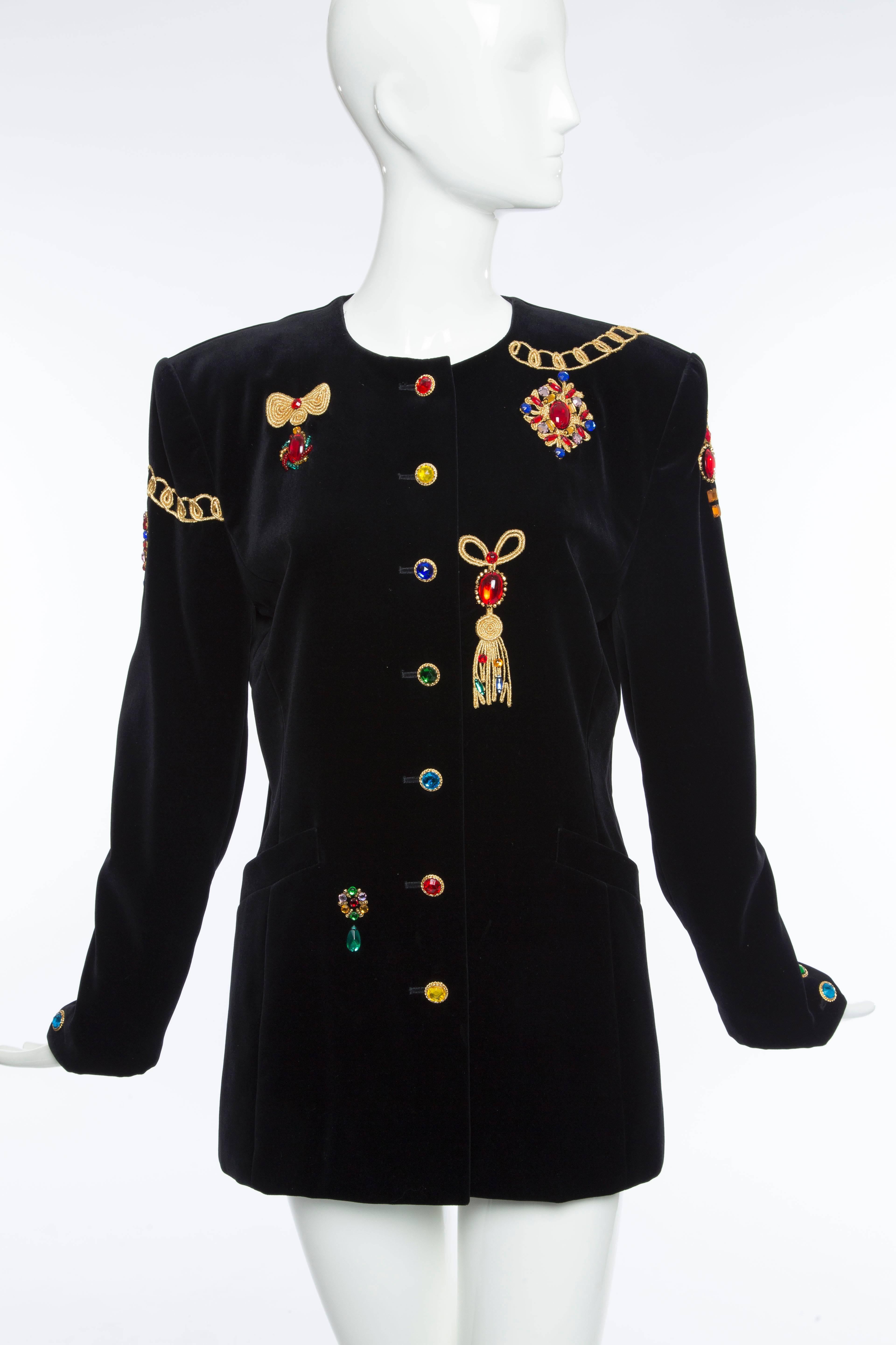 Escada by Margaretha Ley, Circa 1980's, black velvet jacket with polychrome prong set stones and buttons, two front pockets and fully lined.

Bust 39, Waist 34, Hips 38, Length 29.5