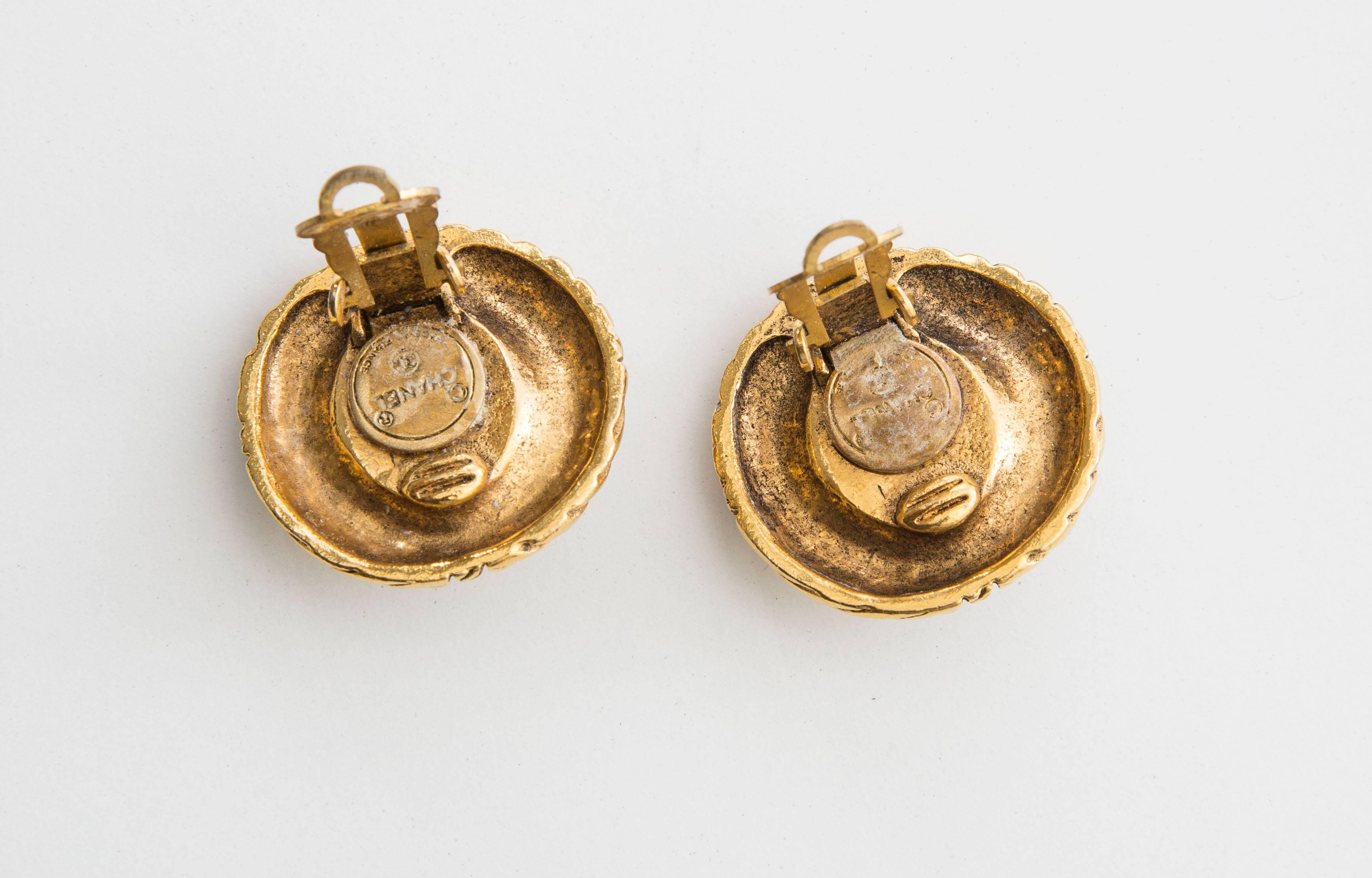 Chanel, circa 1970's gold-tone clip-on earrings with crystal center.