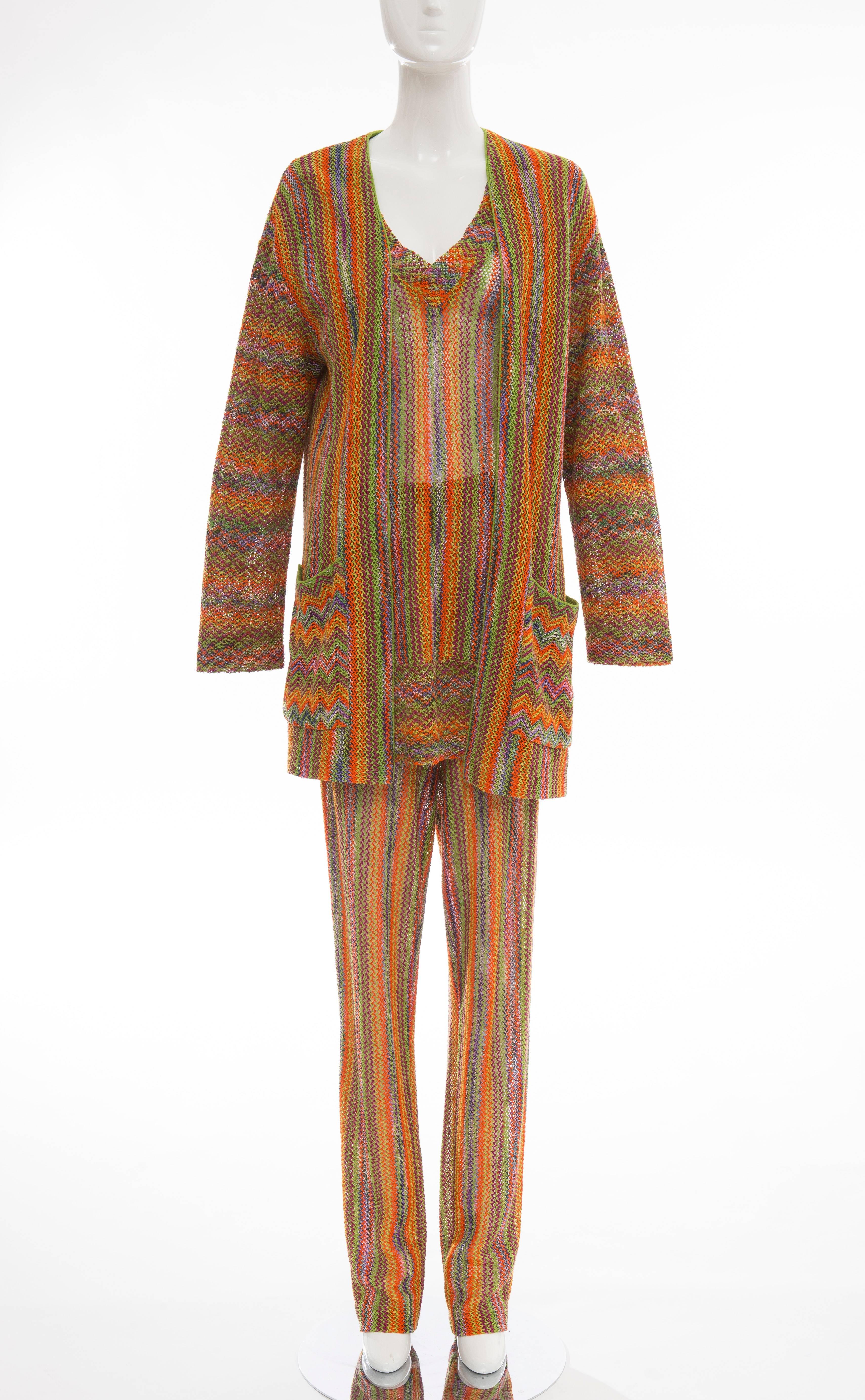 Missoni, circa 1970's, gold label rainbow striped knit pant suit ensemble. Cardigan with two front pockets, V-neck long sleeve top with elastic waist pant and matching long knit scarf.

IT. 44
US. 8

Waist, 26 up to 32
Bust, 40
Pant Length, 46.5
