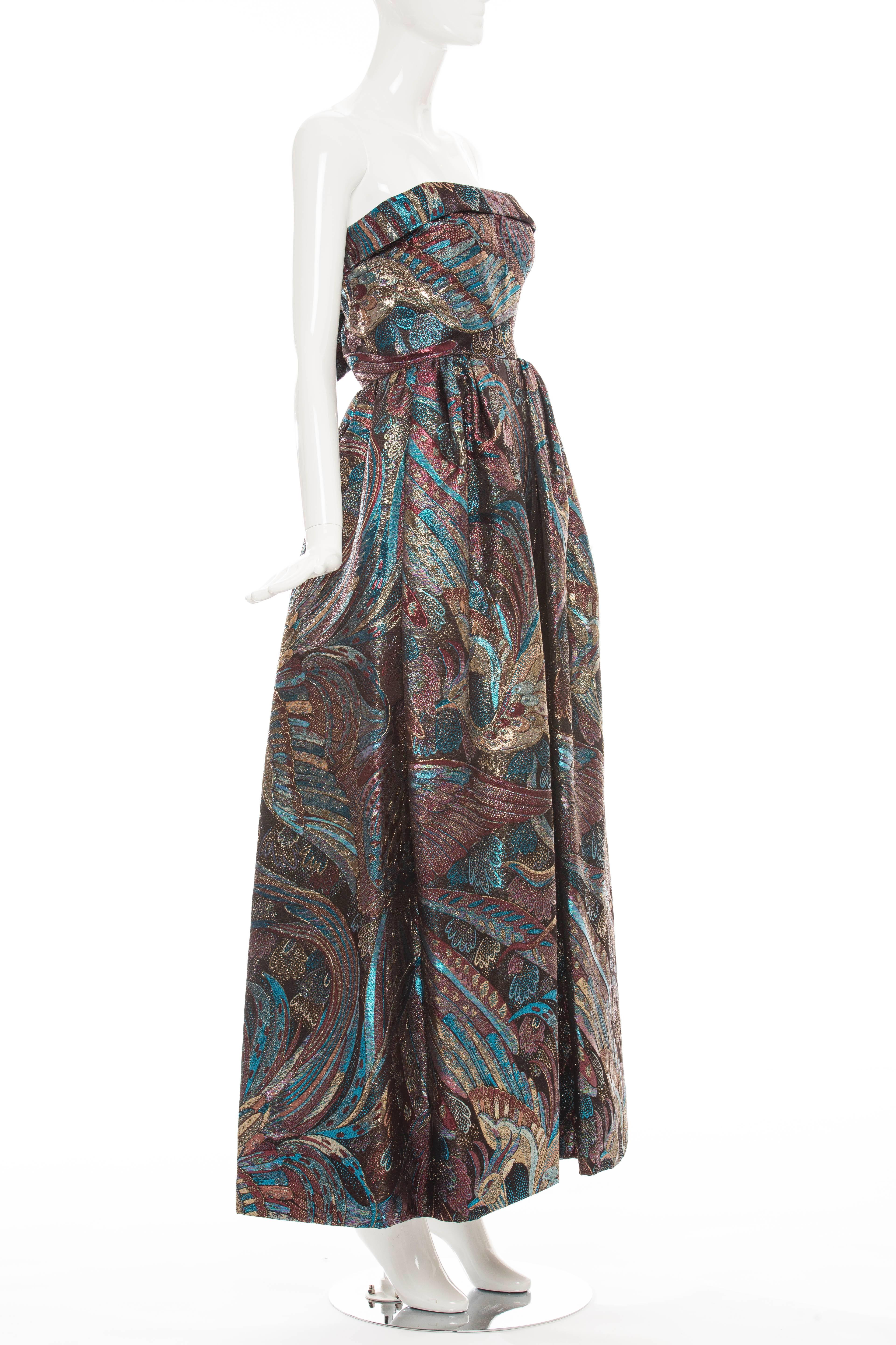 Pauline Trigere, circa 1960's, strapless dress having an allover metallic brocade peacock design, built-in bustier and back zip.