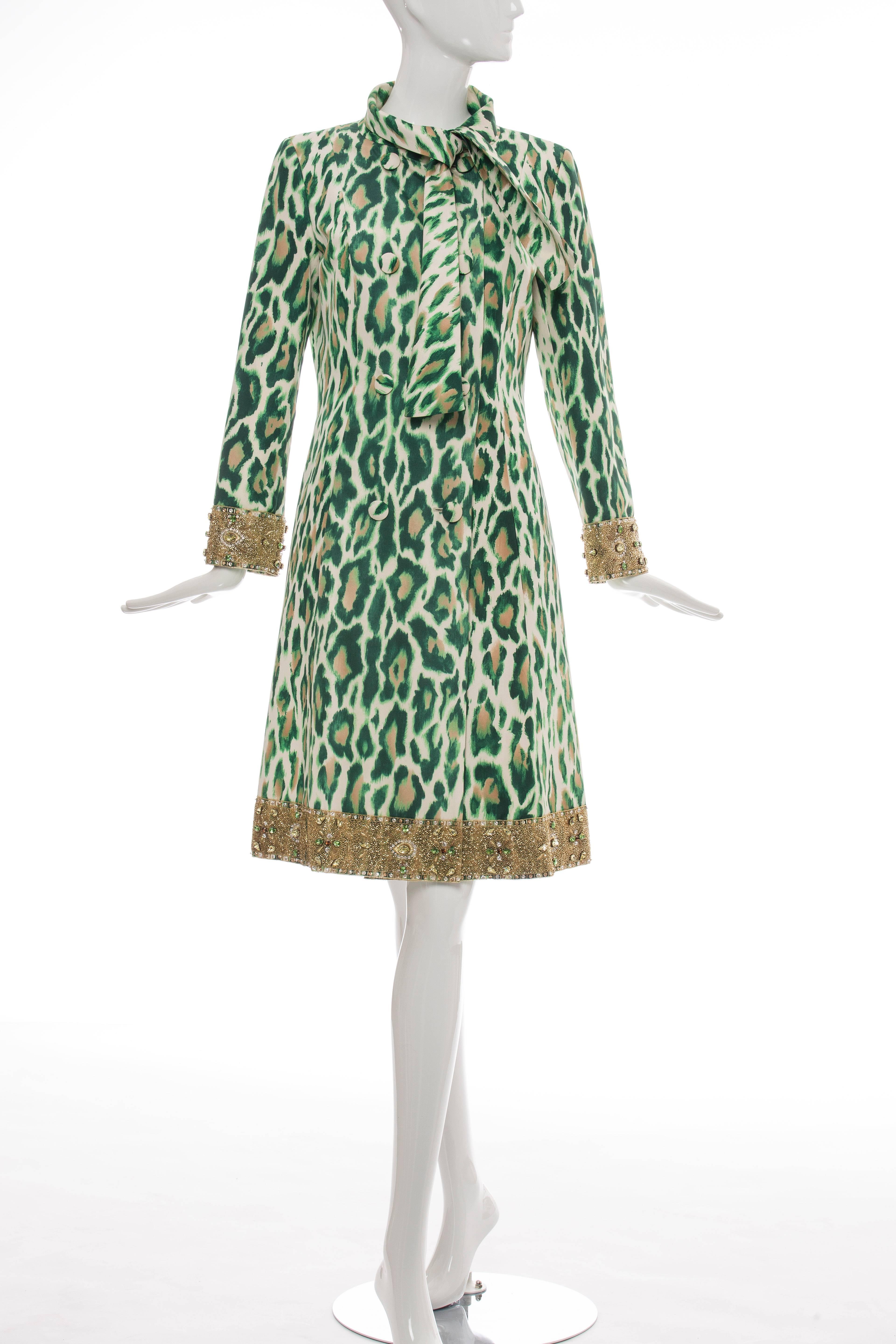  Christian Dior by John Galliano, Resort 2008, silk coat with dual seam pockets at hip, leopard print throughout, gold-tone bead trim at sleeve and bottom hem, tie accent at neck and exposed tonal button closures at front.

FR 38
US 6

Bust