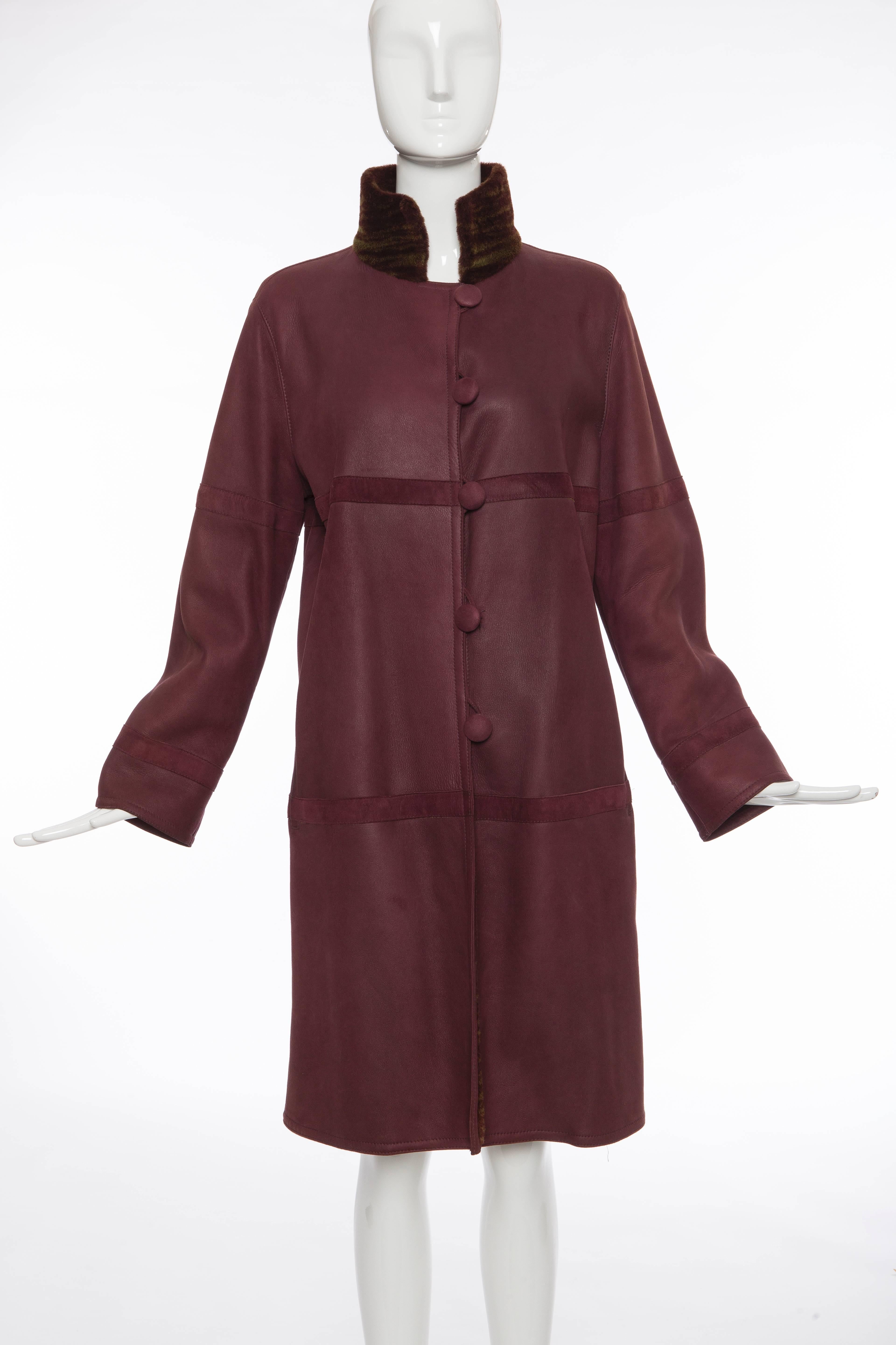 Oscar De la Renta Couture, plum button front,shearling coat with two front pockets.