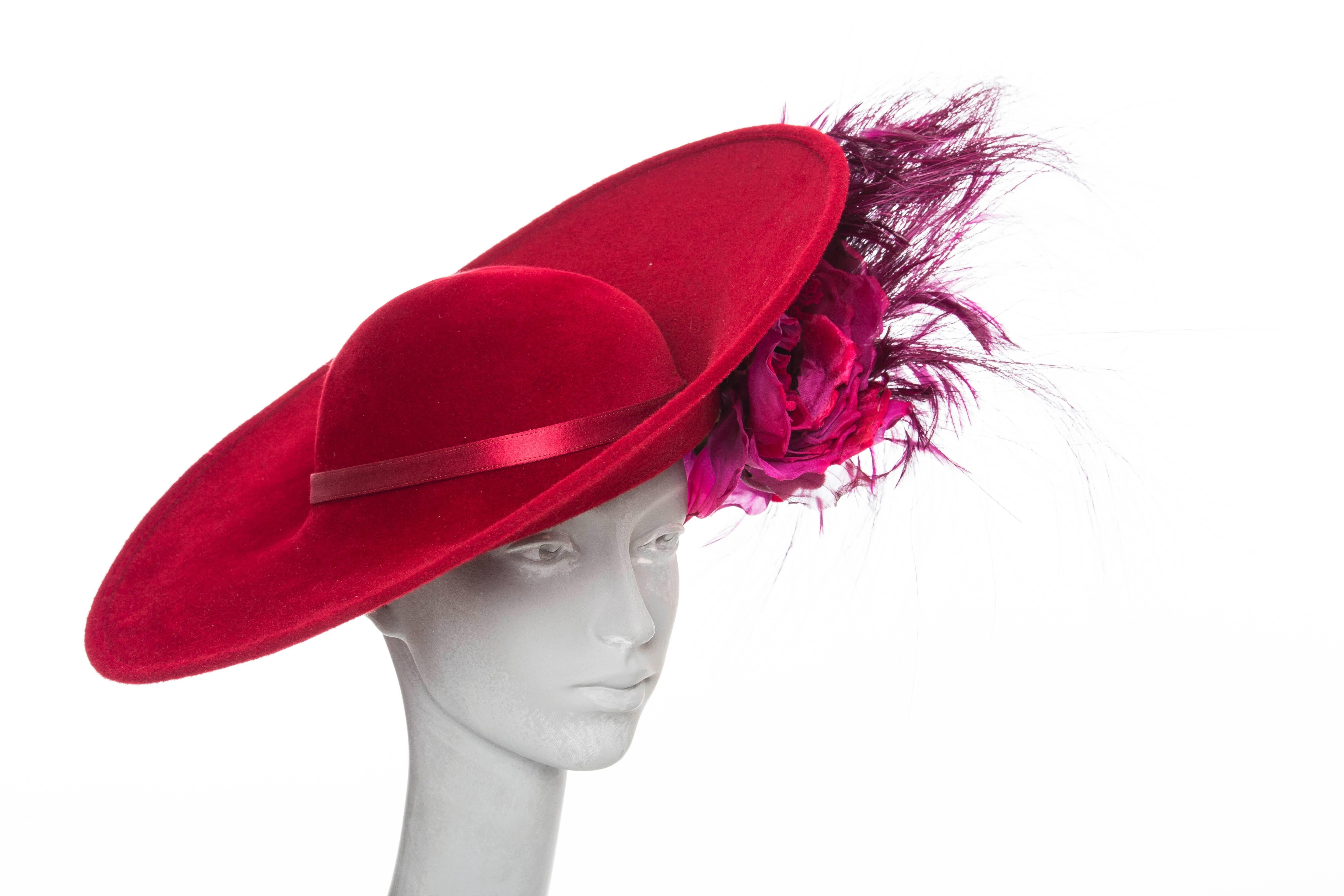  Philip Treacy wool felt statement side slice hat with floral and feature adornment at side. Includes box.

 Circumference 22”, Brim 5”
