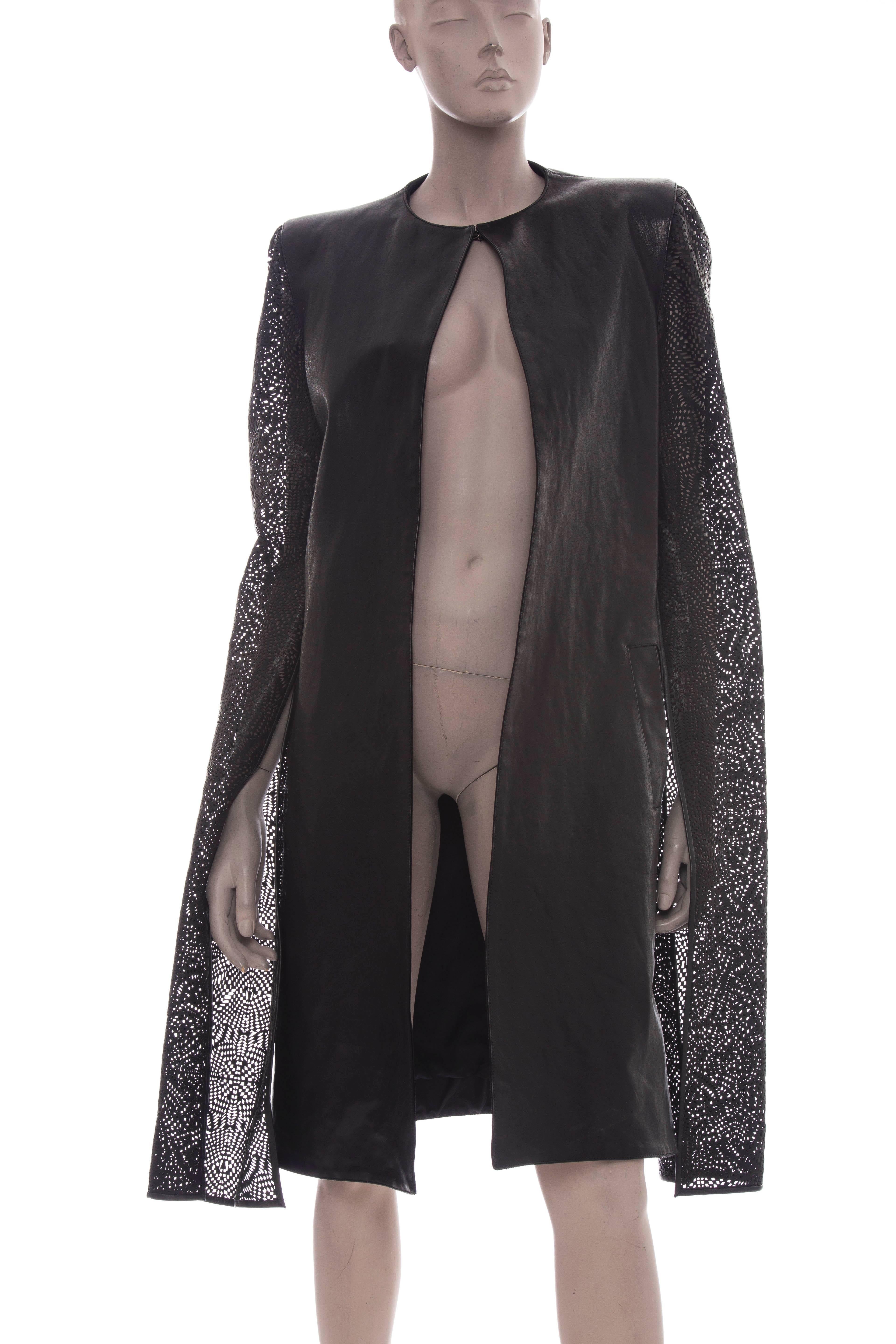 Gareth Pugh, Spring 2013, black leather coat with elongated laser cut sleeves, pleating at back, seam pockets and hook closure at collar.

IT 46
US 10
Bust 36”, Waist 34”, Shoulder 16”, Length 39”, Sleeve 42”