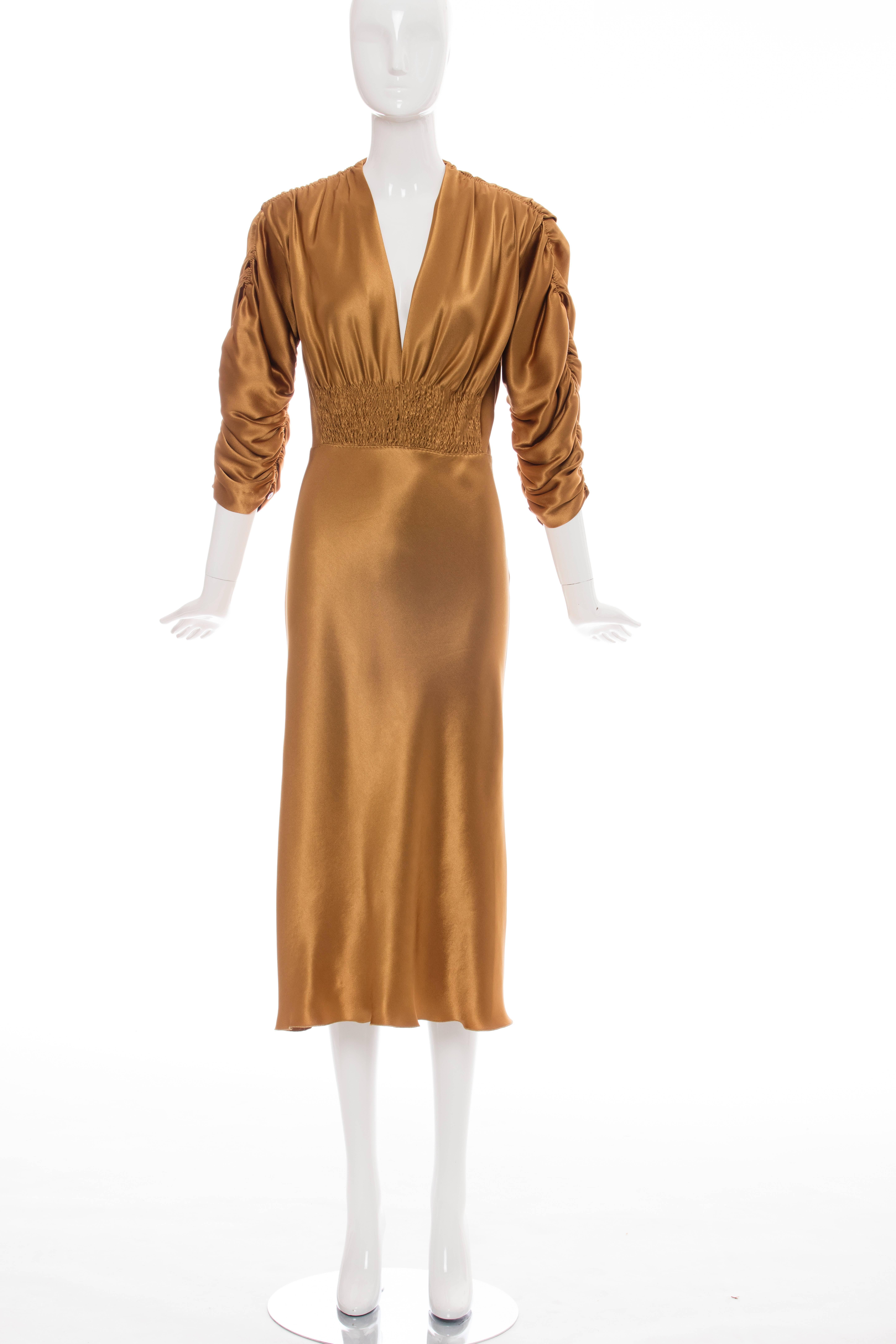 Jean Paul Gaultier, circa 1990's, silk charmeuse dress with smocking at waist, ruching at shoulders and sleeves, snap front and side zip.

US. 8