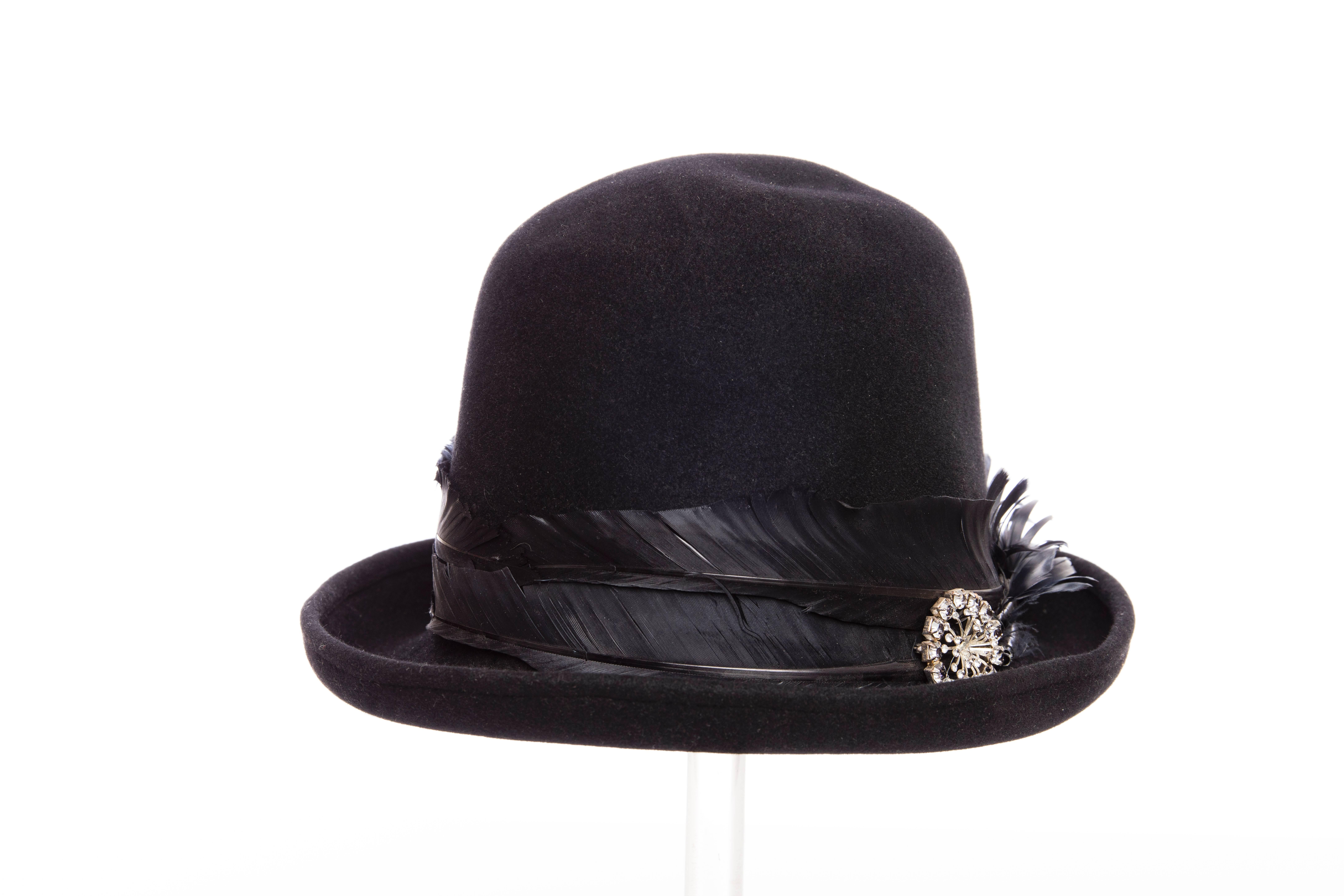  Comme Des Garçons Homme Plus by Stephen Jones men's black wool hat with feather and jewel embellished at exterior.

Circumference 22 -  Brim 2.5