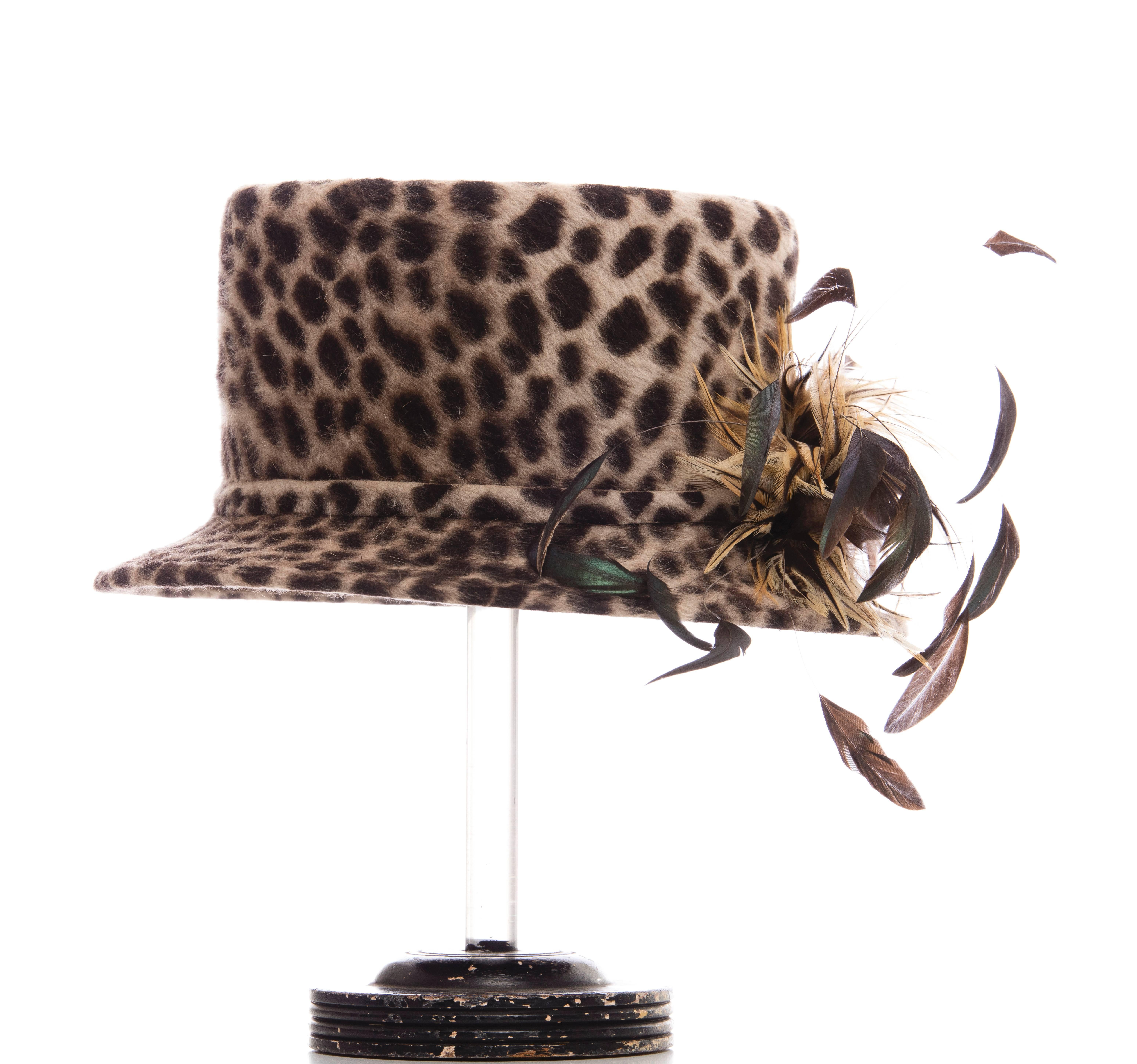  Philip Treacy wool hat with cheetah print throughout, feather accents at brim and tonal stitching throughout. Includes box.

Circumference 25”, Brim 2.25”