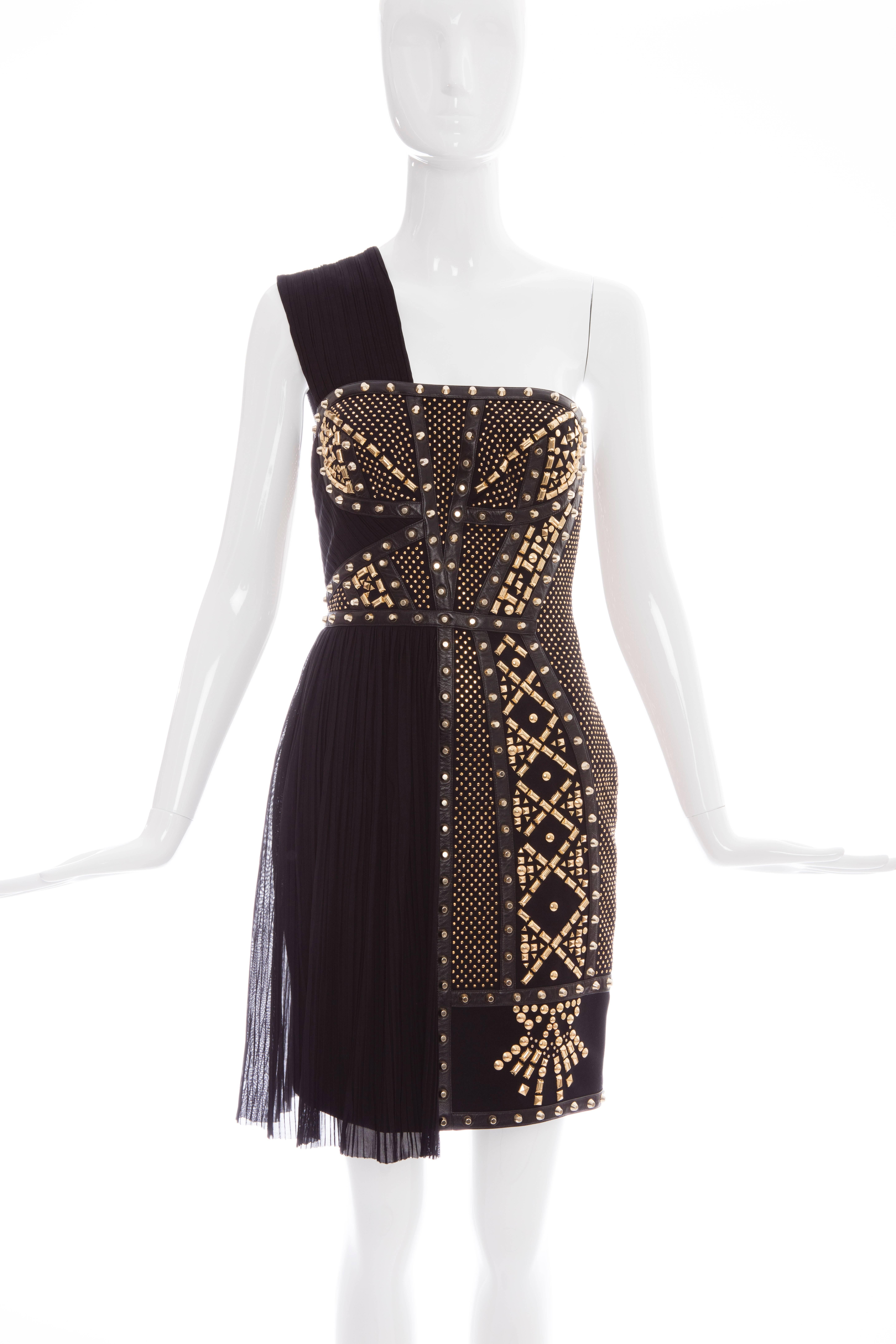  Versace, Spring 2012, one-shoulder dress with leather trim and gold-tone stud geometric embellishment throughout, plisse panel at side skirt and exposed zip closure at center back.

IT. 38
US. 2

Bust 27”, Waist 24”, Hip 34”, Length