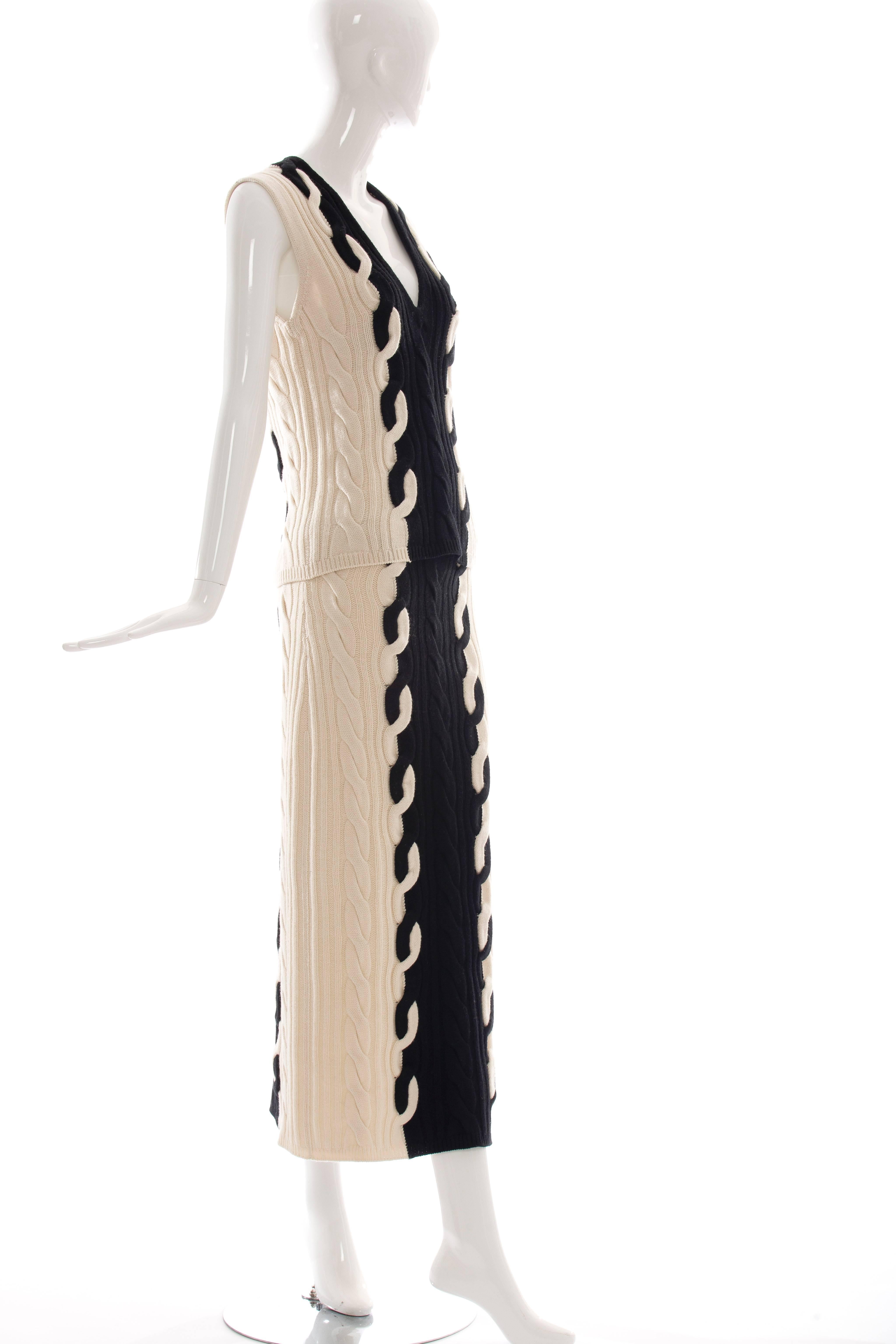  Christian Dior by Raf Simons, Fall 2013, virgin wool cashmere-blend cable knit V- neck sweater skirt suit. Skirt is fully lined with invisible side zip.

FR. 40
US. 8

78% Virgin Wool, 22% Cashmere
