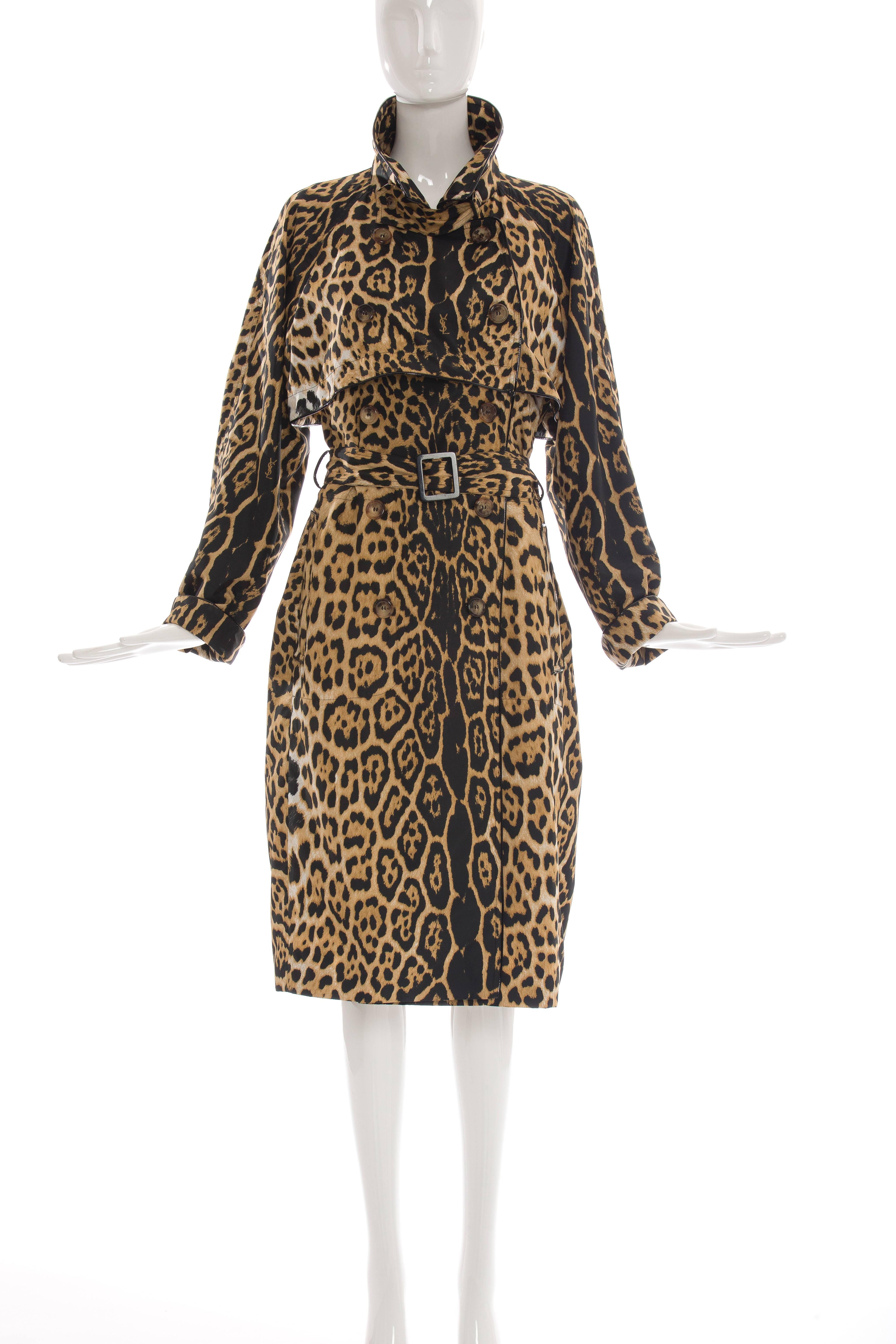 Yves Saint Laurent by Stefano Pilati, circa 2005, double-breasted trench coat with storm flaps, leopard print throughout dual slit pockets at hips, matching belt at waist and button closures at front.

FR.42
US. 10

Bust 44”, Waist 44”,