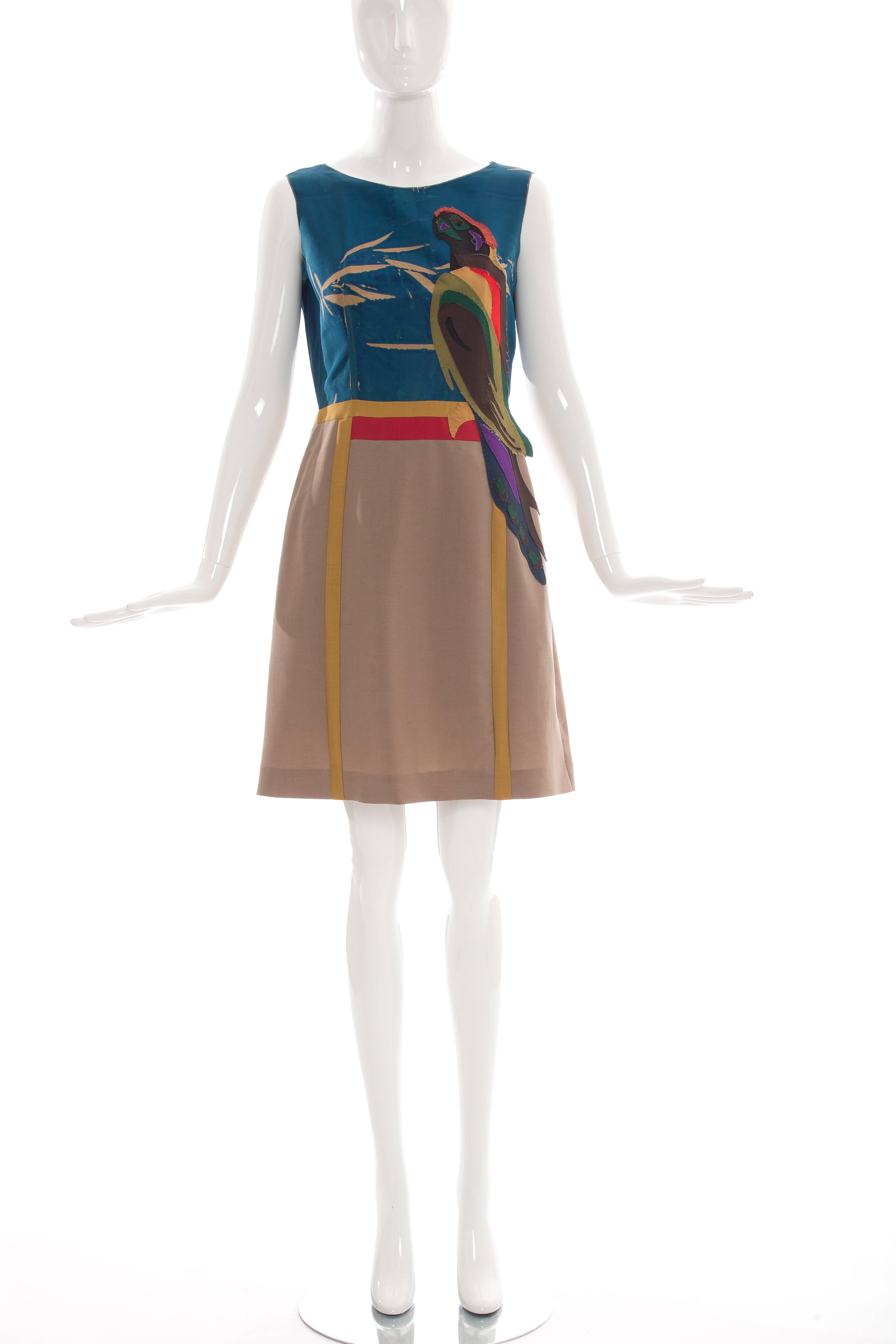 Prada, Spring 2005, sleeveless silk dress with applique parrot motif, wool skirt, fully lined and concealed side zip closure.

IT. 42
US. 6

Bust 34”, Waist 28”, Hip 37”, Length 36”
Fabric Content: 100% Silk; Bottom 60% Mohair, 40% Wool;