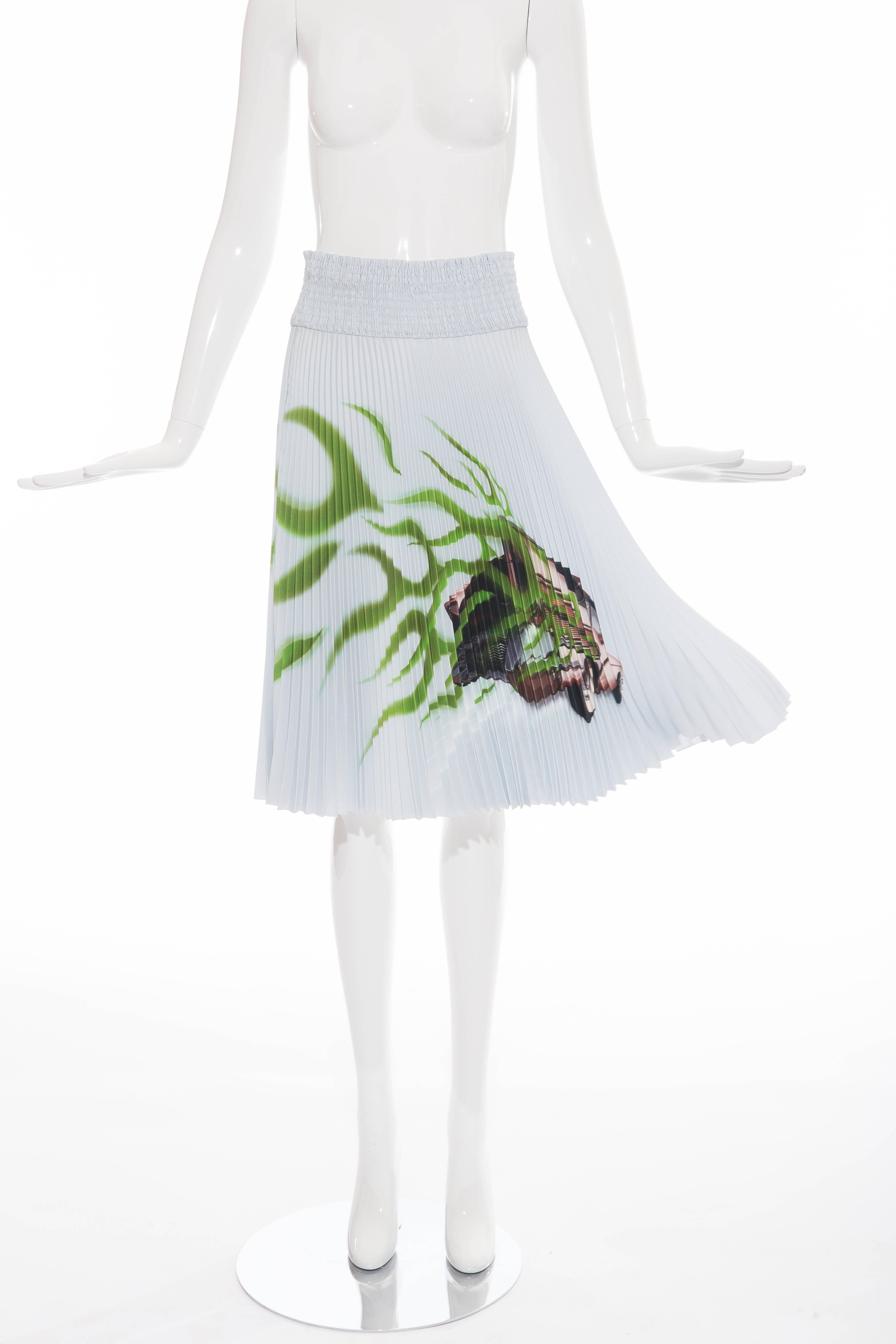 Prada, Spring-Summer 2012,  skirt with Cadillac car printed at front, accordion pleats throughout, elasticized waist and concealed side zip.

Waist 28”, Hip 32”, Length 26”