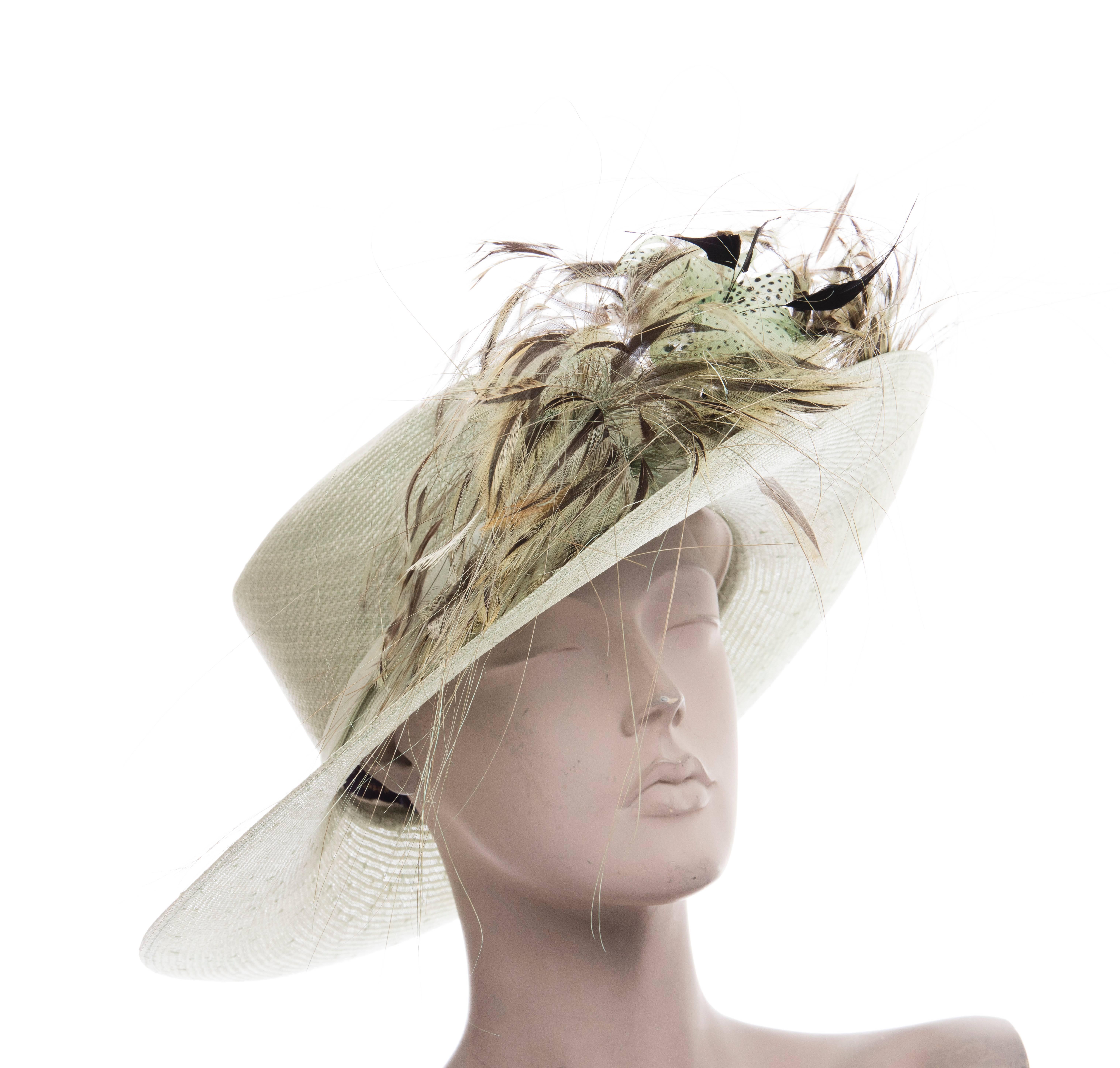  Philip Treacy sinamay derby hat with oversize feather accent. Includes box.

Circumference 22”, Brim 5”